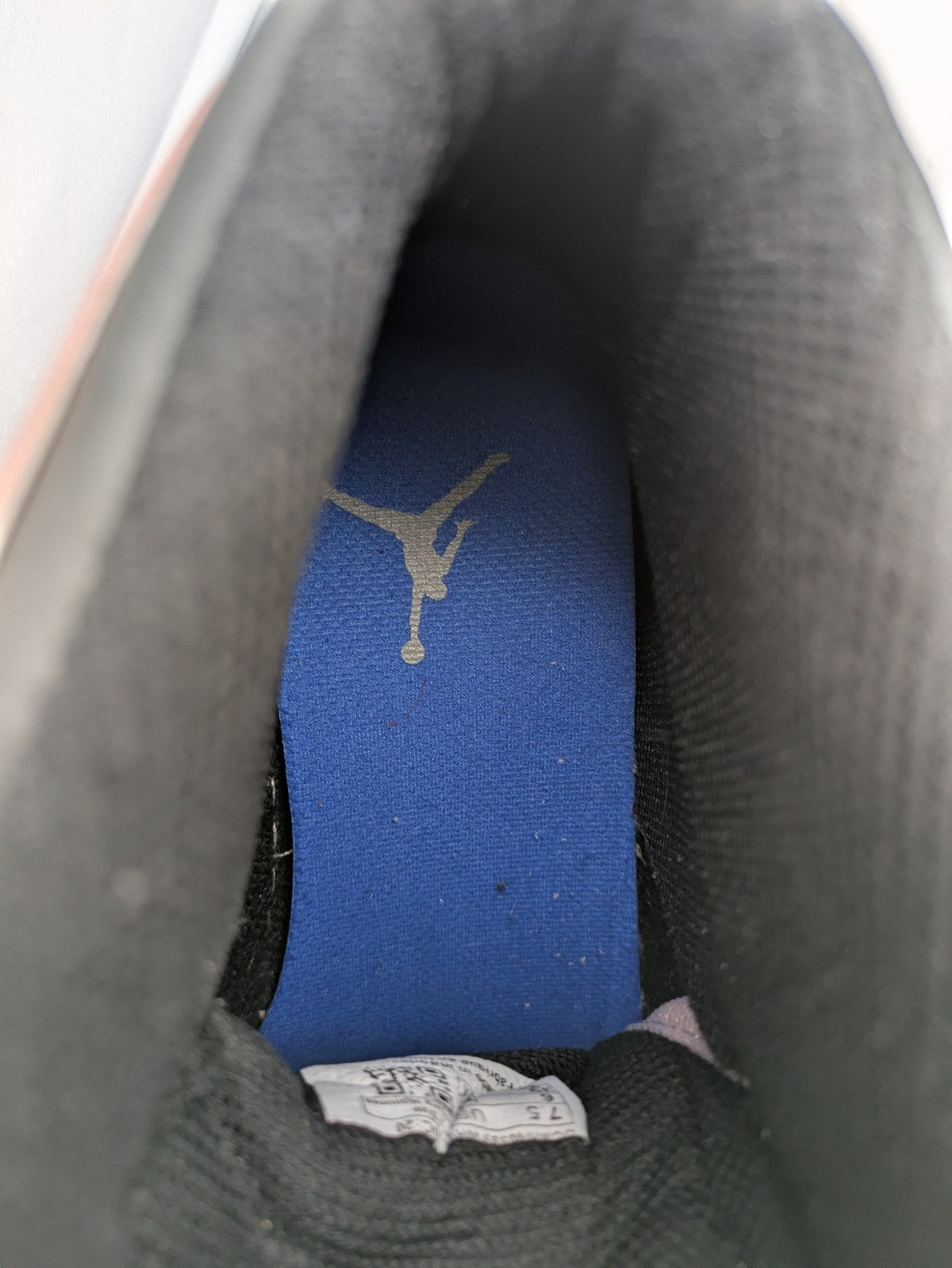 Nike Air Jordan high-top sneakers multi with Wings logo, Jumpman detail, and perforated toe.