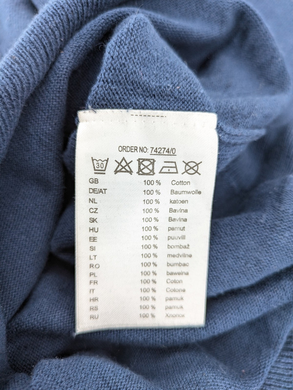 Queen blue knit jumper with embroidered crest logo, V-neck, 100% cotton.