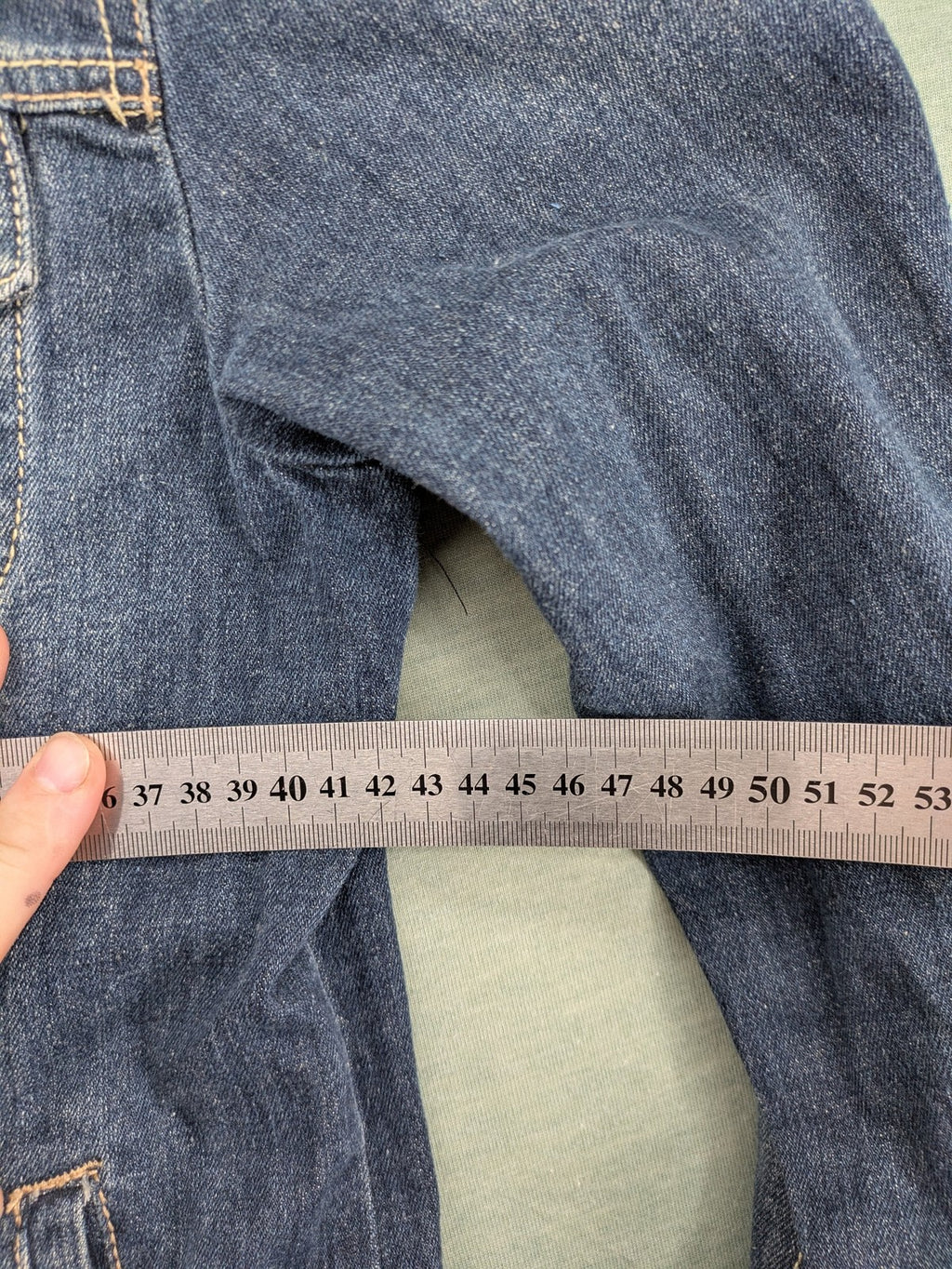 BLU blue denim trucker jacket with button placket and two chest pockets.