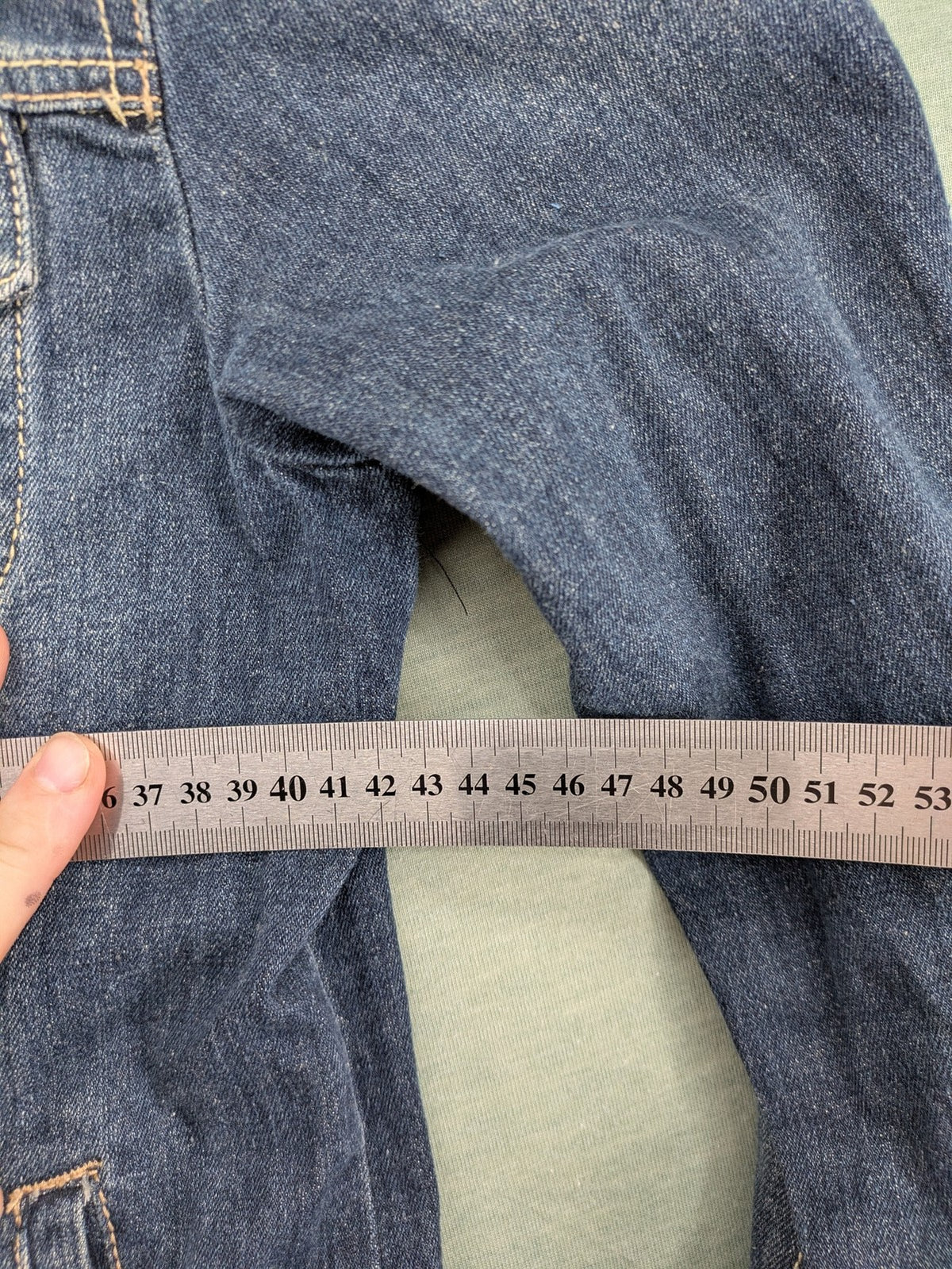 BLU blue denim trucker jacket with button placket and two chest pockets.