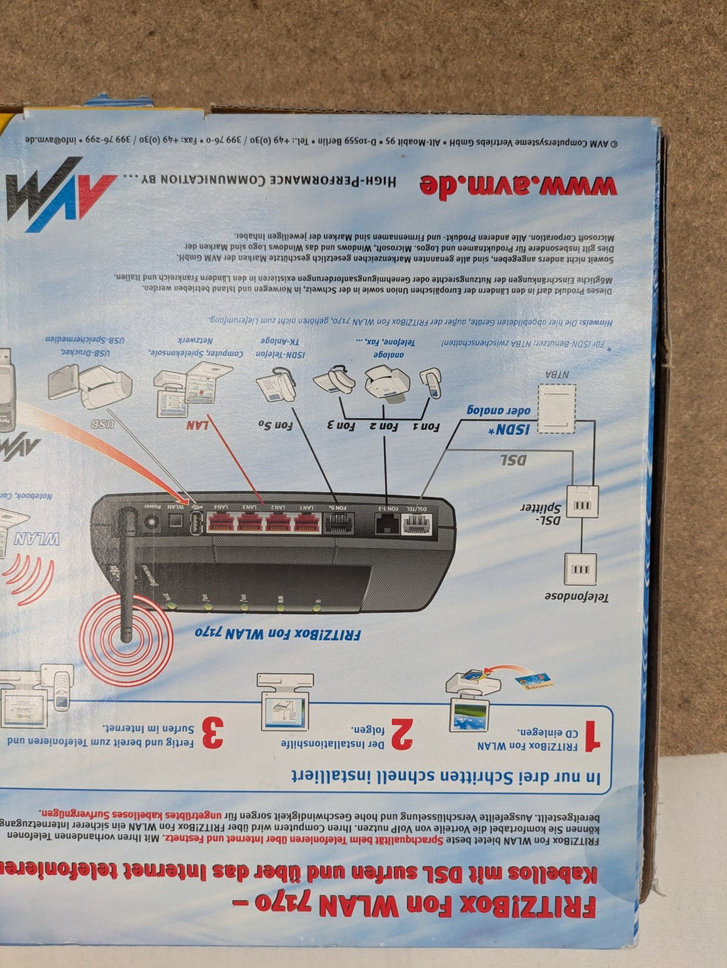AVM wireless router black grey yellow with logo and integrated DSL modem features.