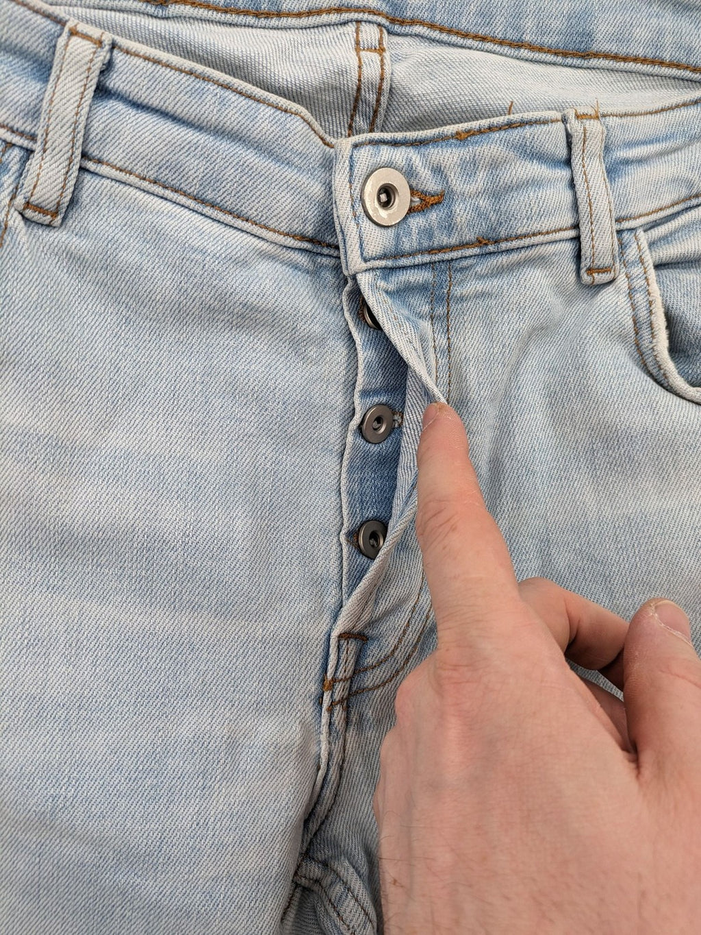 Zara blue straight jeans with distressed knees and classic button fly.