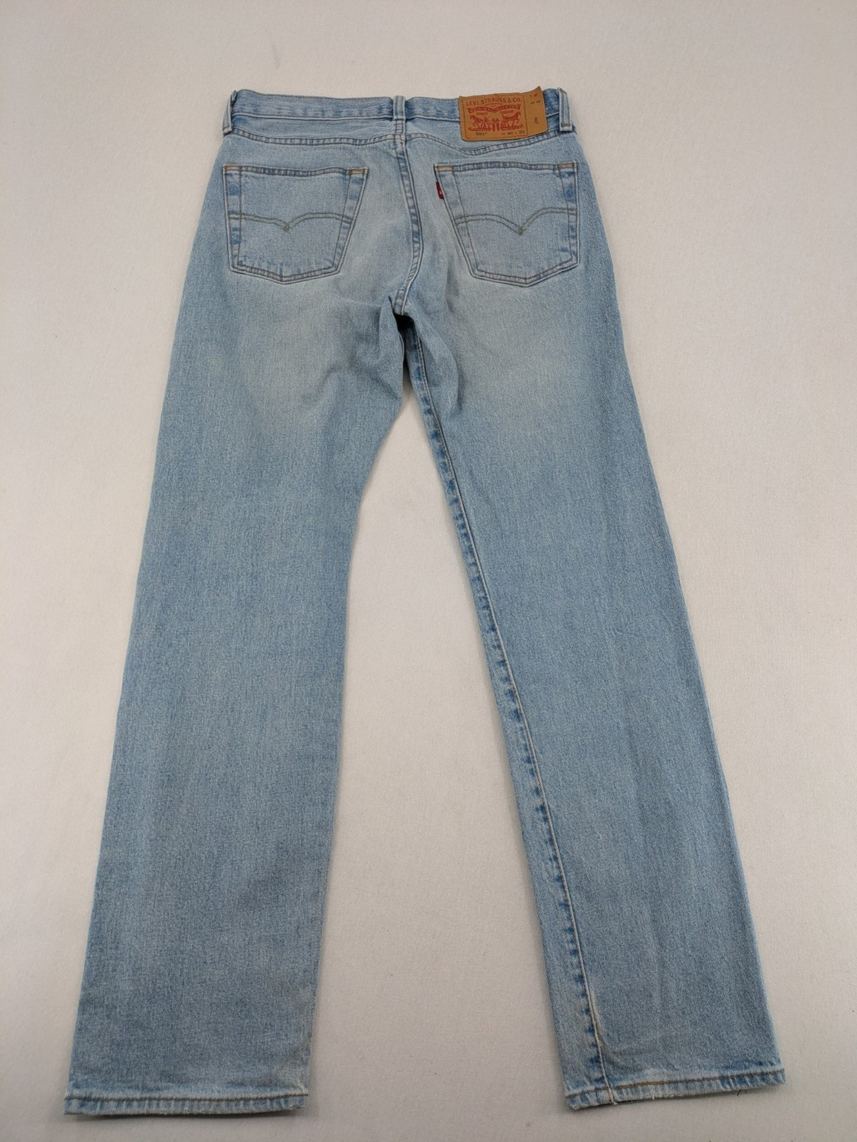 Levi's blue straight jeans light wash denim with button fly and classic fit.