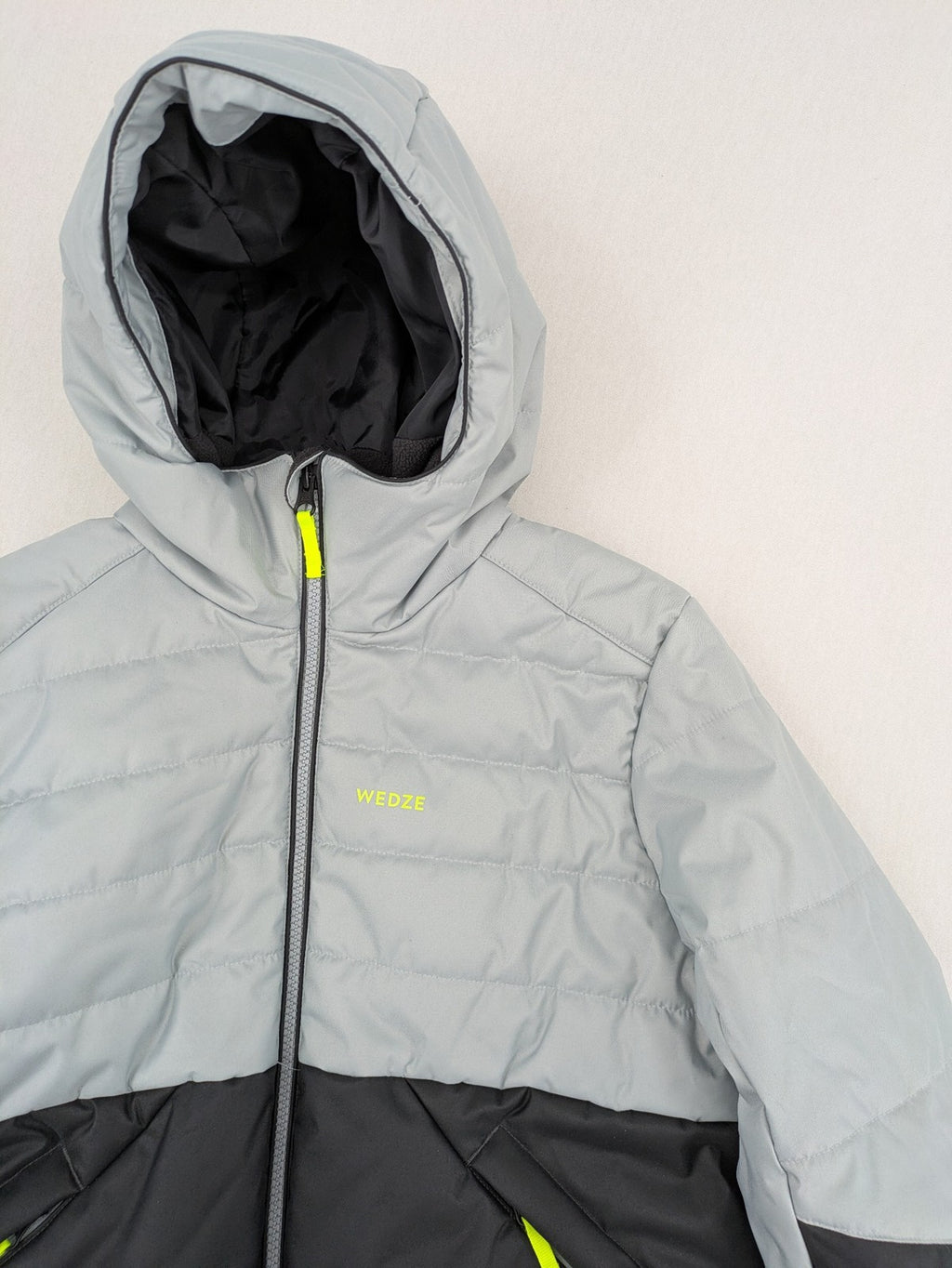 Wedze ski coat grey and black colorblock design with neon accents and fleece lining.