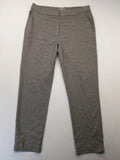 H&M beige pants houndstooth pattern with black and brown tones, stretchy material.