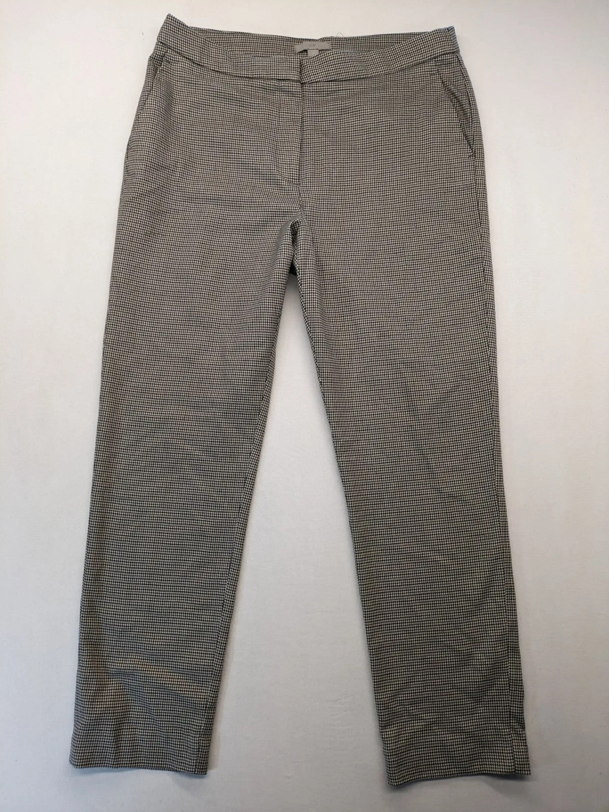 H&M beige pants houndstooth pattern with black and brown tones, stretchy material.