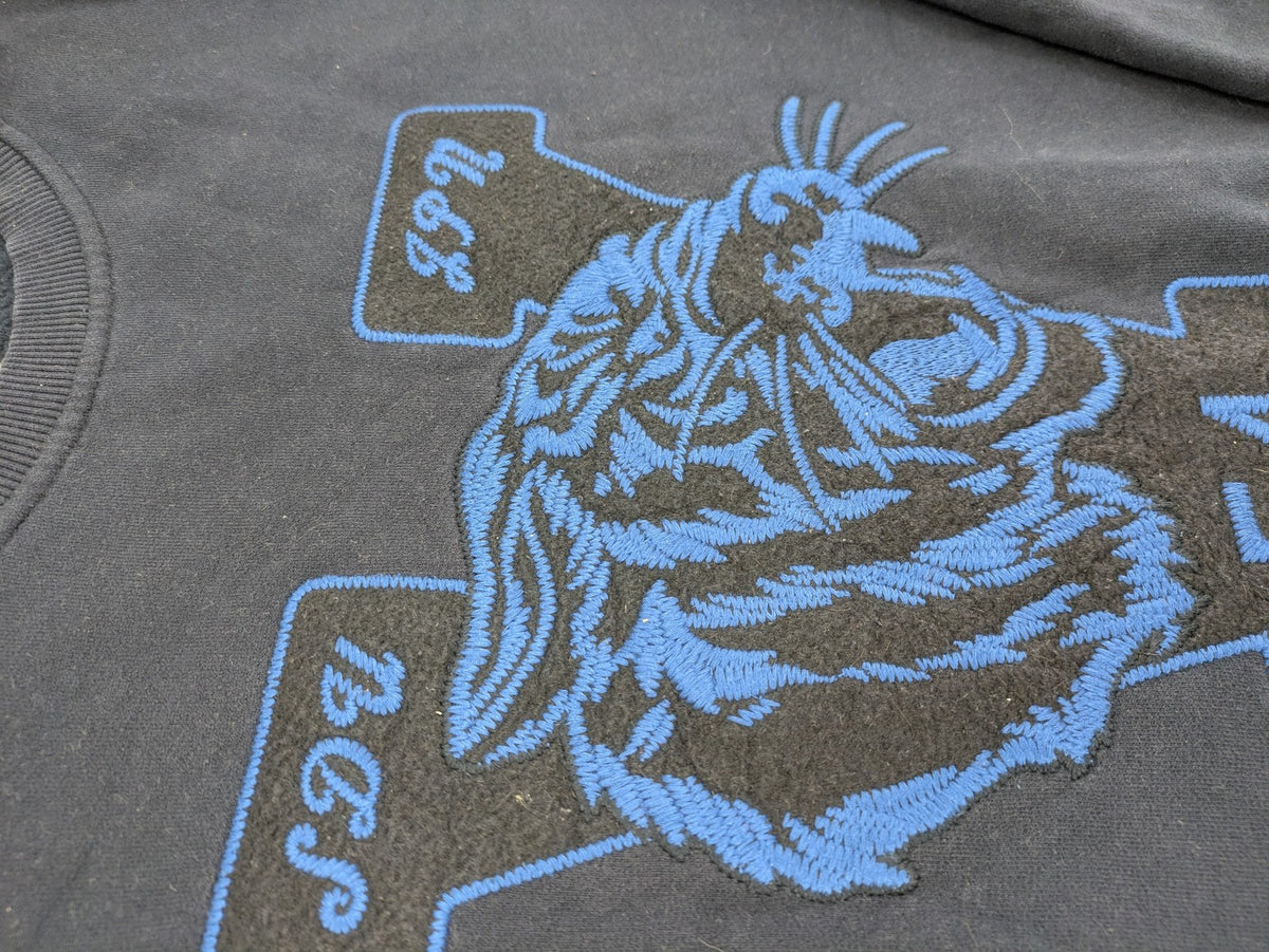 Superdry navy sweatshirt with embroidered tiger graphic and "JPN 54" chenille detail.