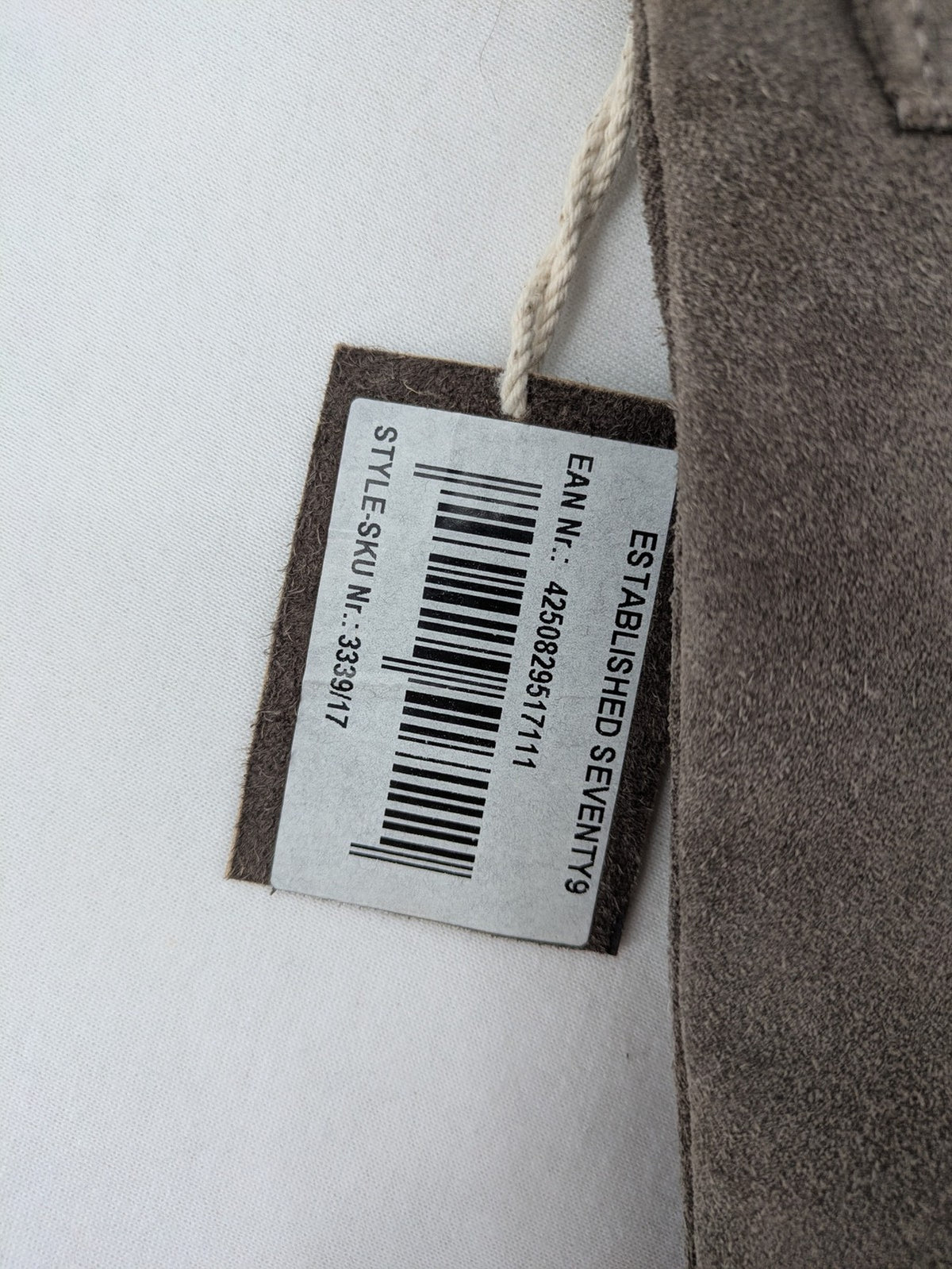 CNTMP grey suede crossbody handbag with flap and silver twist lock closure.