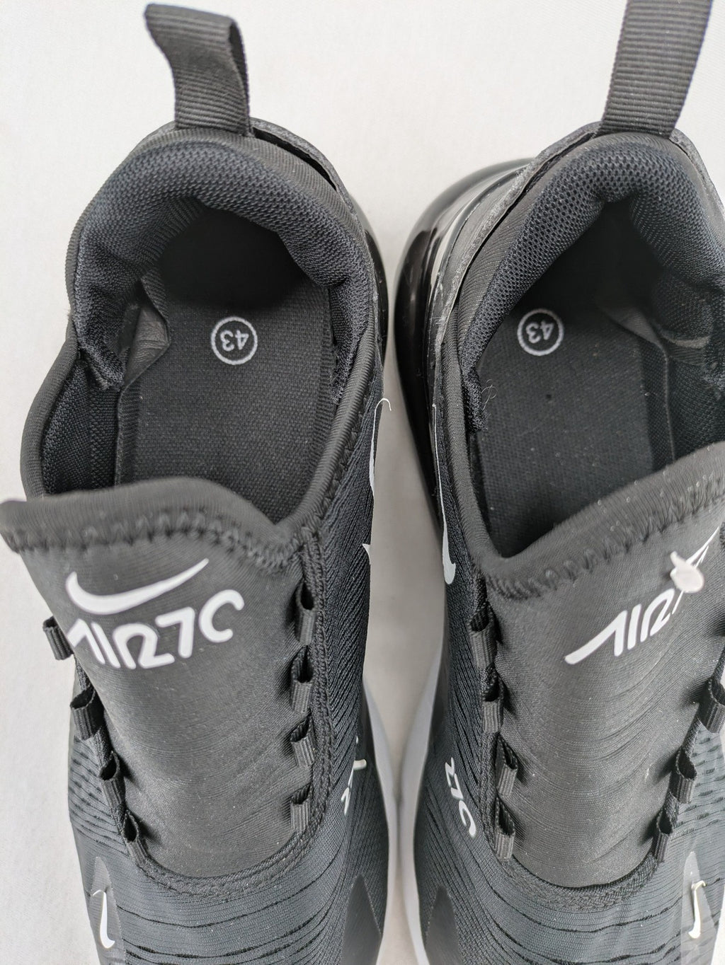 Nike Air Max 270 black and grey sneakers with large Air unit and white accents