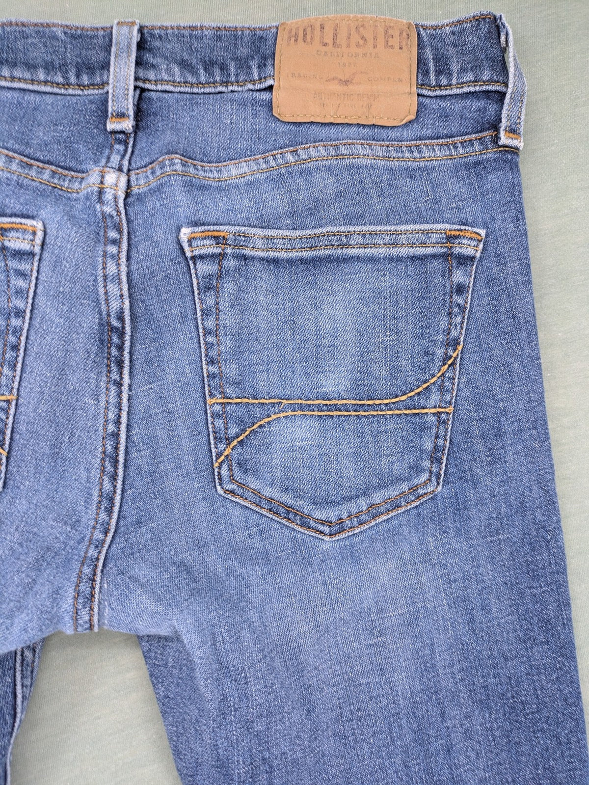 Hollister blue slim fit jeans with classic 5-pocket design and stretch denim material.