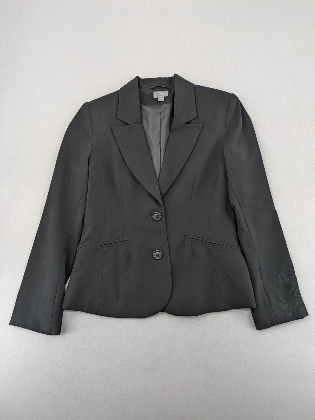 Lindex black blazer coat two-button design with subtle embroidery and tailored silhouette.
