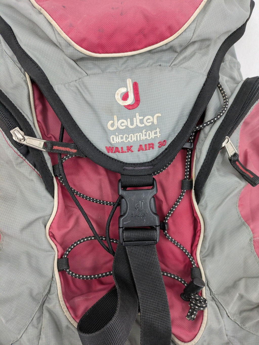 Deuter grey and pink Aircomfort Walk Air 30 rucksack with mesh back system.