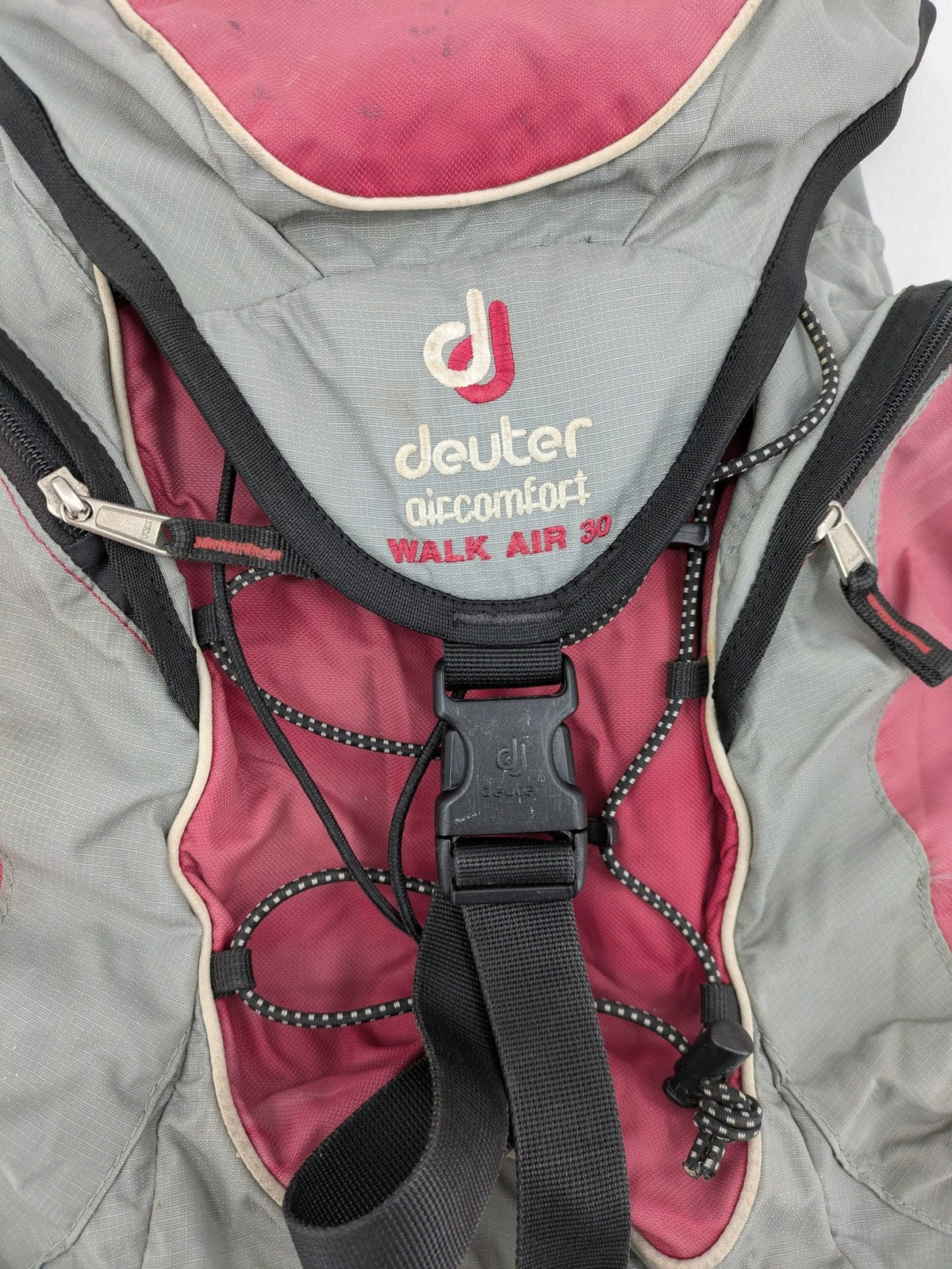 Deuter grey and pink Aircomfort Walk Air 30 rucksack with mesh back system.