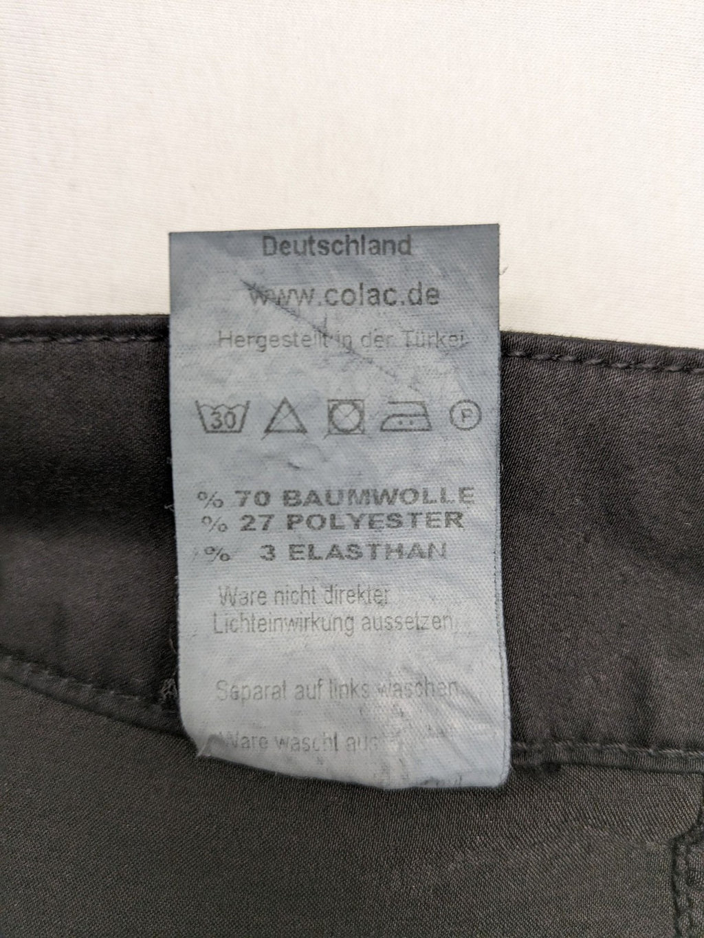 Colac black straight jeans high waist with double button, zipper pockets, and stretch material.