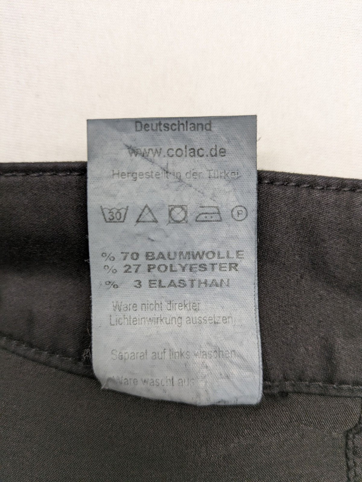 Colac black straight jeans high waist with double button, zipper pockets, and stretch material.
