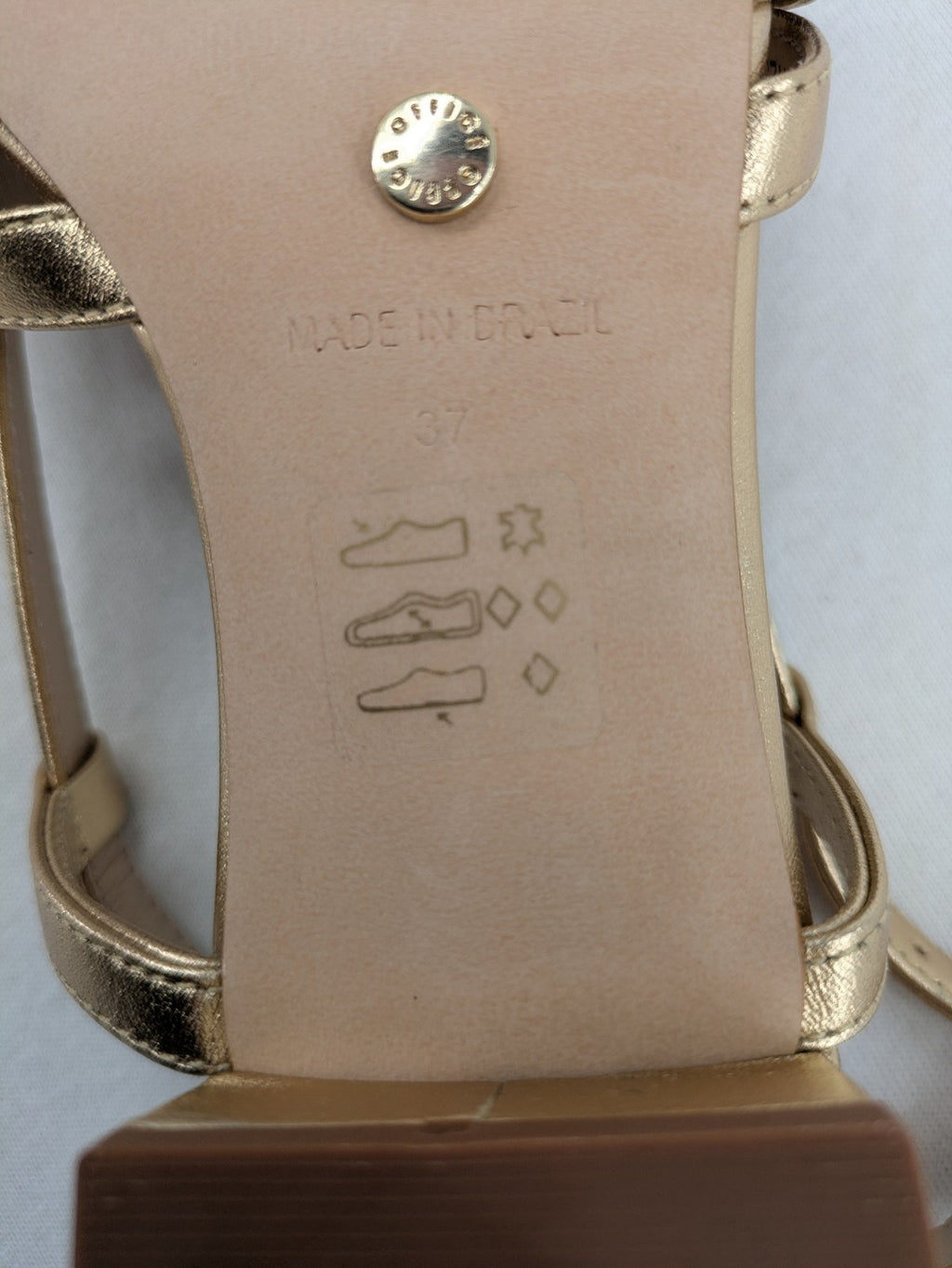 Office London gold metallic sandals with adjustable ankle strap and block heel design.
