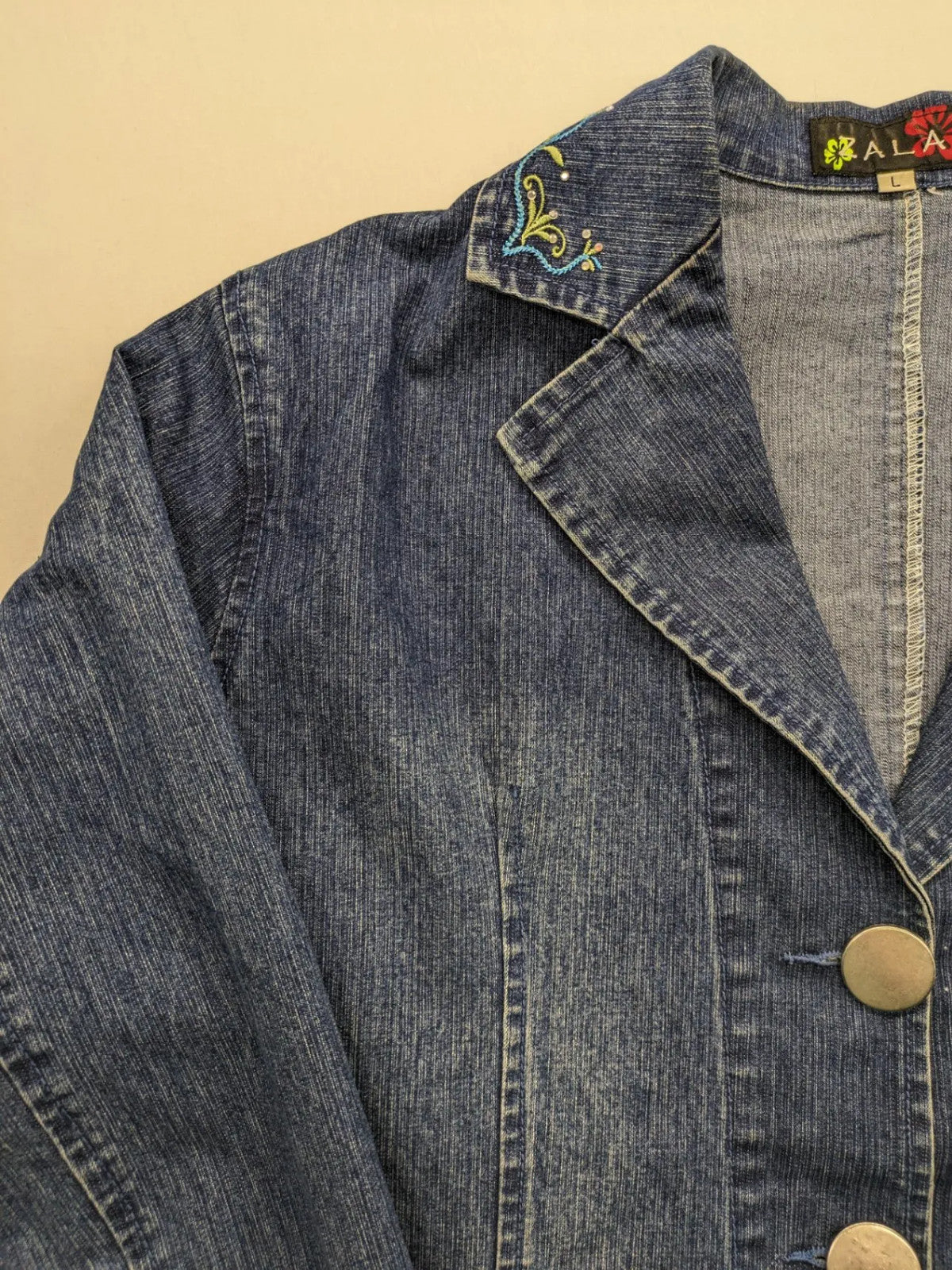 Zala blue denim blazer jacket with embroidered details and classic button closure.