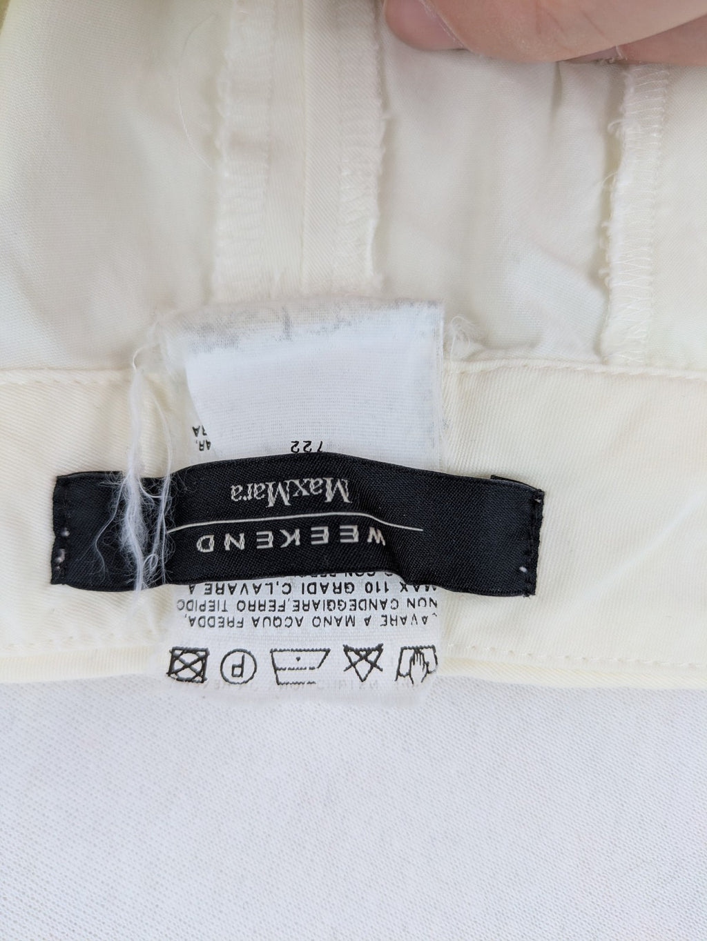 MaxMara cream cropped chino pants with zipper closure, belt loops, and back pockets.
