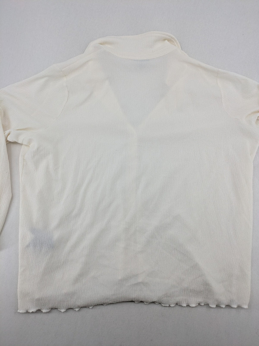 C&A cream blouse XXL textured crinkle fabric with gold button placket and wavy hem.