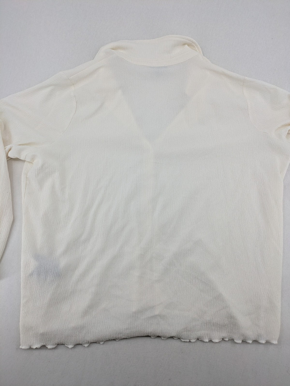 C&A cream blouse XXL textured crinkle fabric with gold button placket and wavy hem.