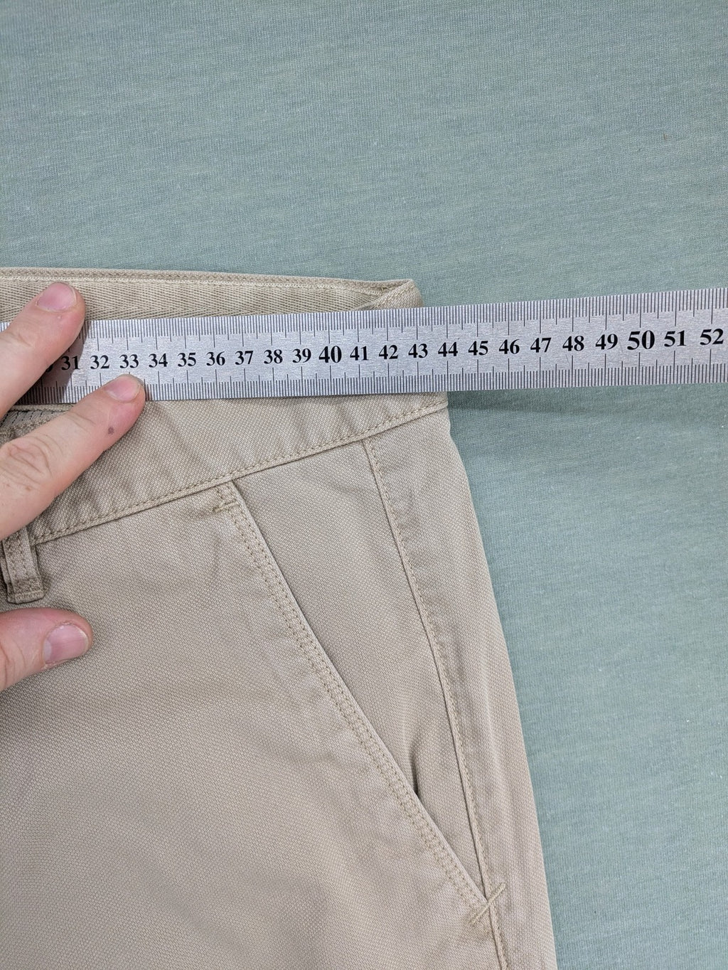 Marc O'Polo beige tapered fit chino pants, soft cotton stretch fabric, modern silhouette.