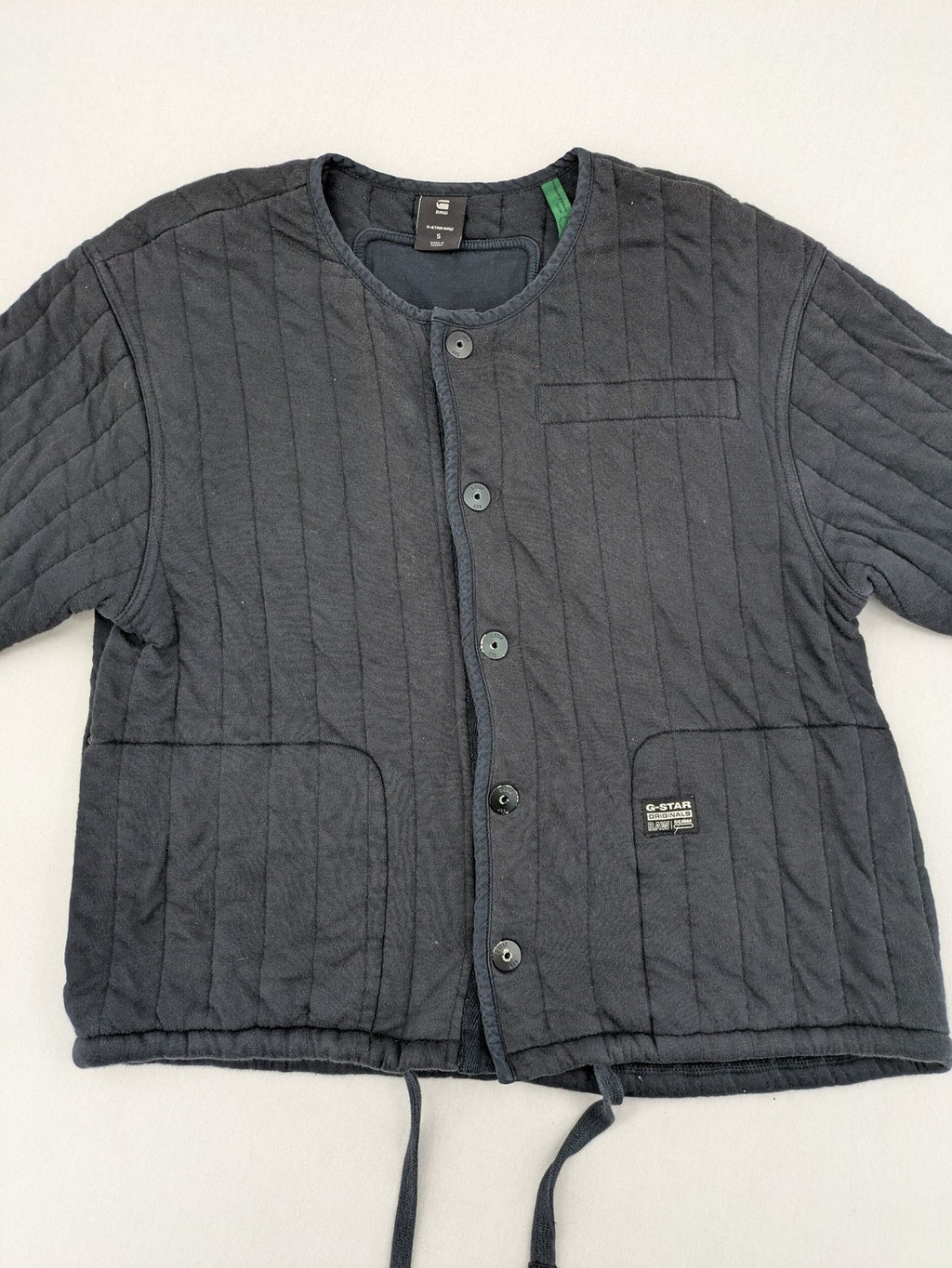 G-Star Raw grey quilted jacket with button closure and adjustable drawstring hem.
