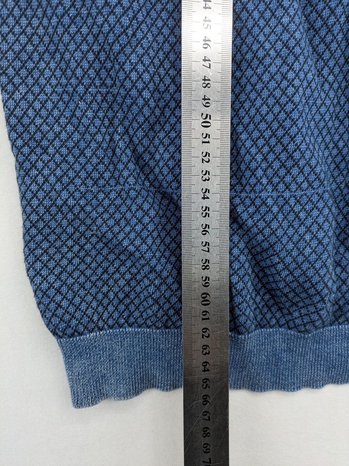 Gas blue turtle neck jumper with diamond pattern, three-button Henley neck, and contrasting trim.