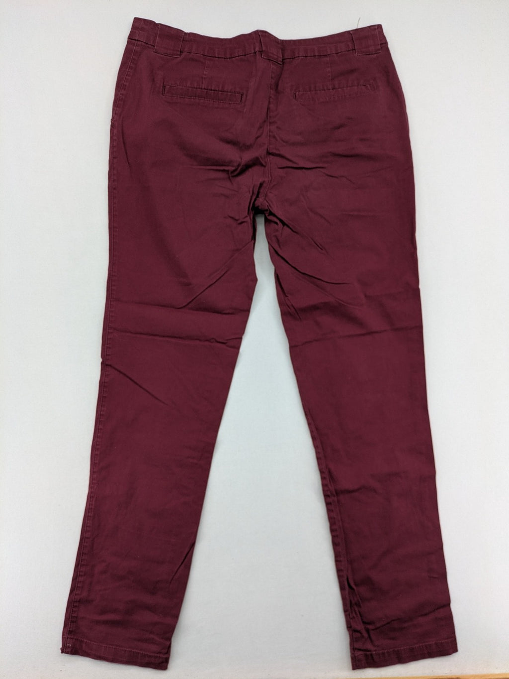 BPC Bonprix burgundy chino pants with front pleats and floral pocket lining.