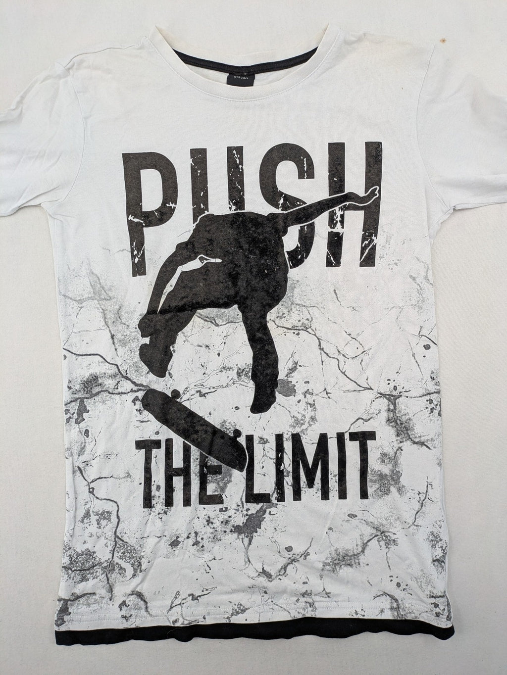 Chapter Young long sleeve shirt white with black skateboarder graphic and motivational text.