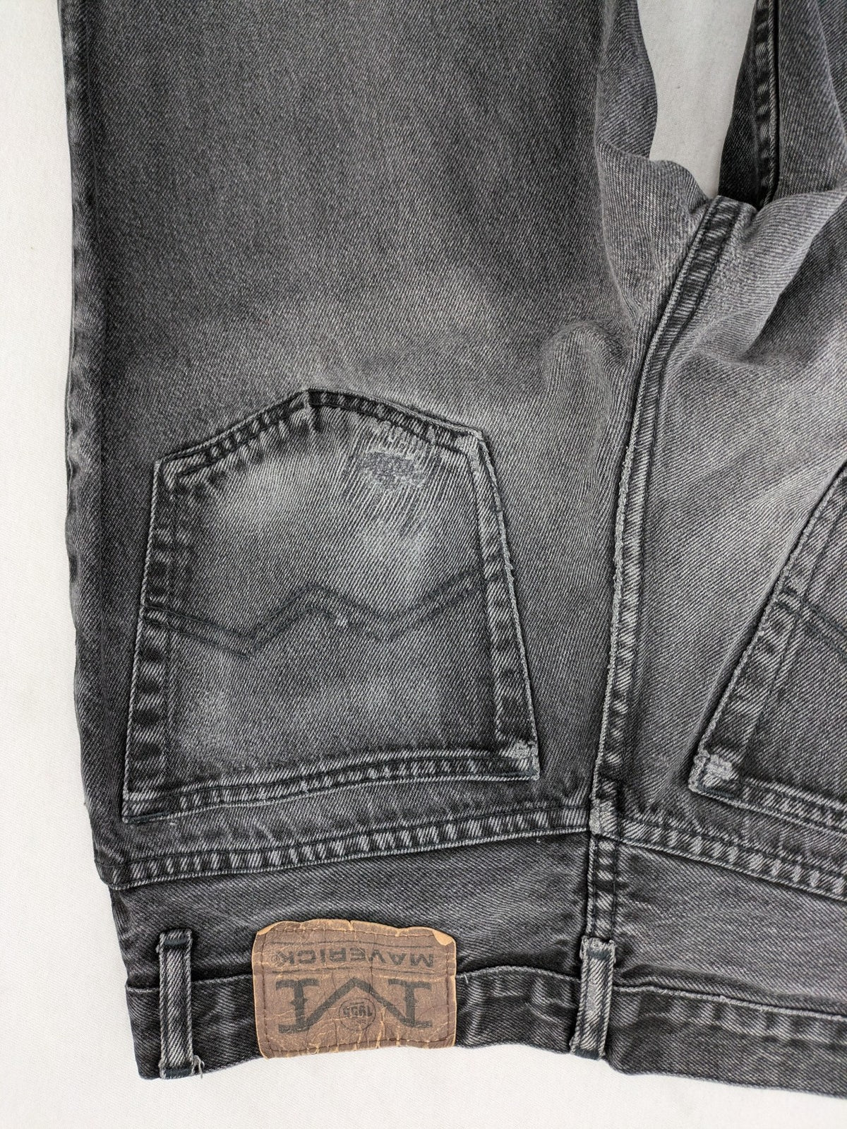 Maverick black straight jeans faded wash with iconic logo on back patch.