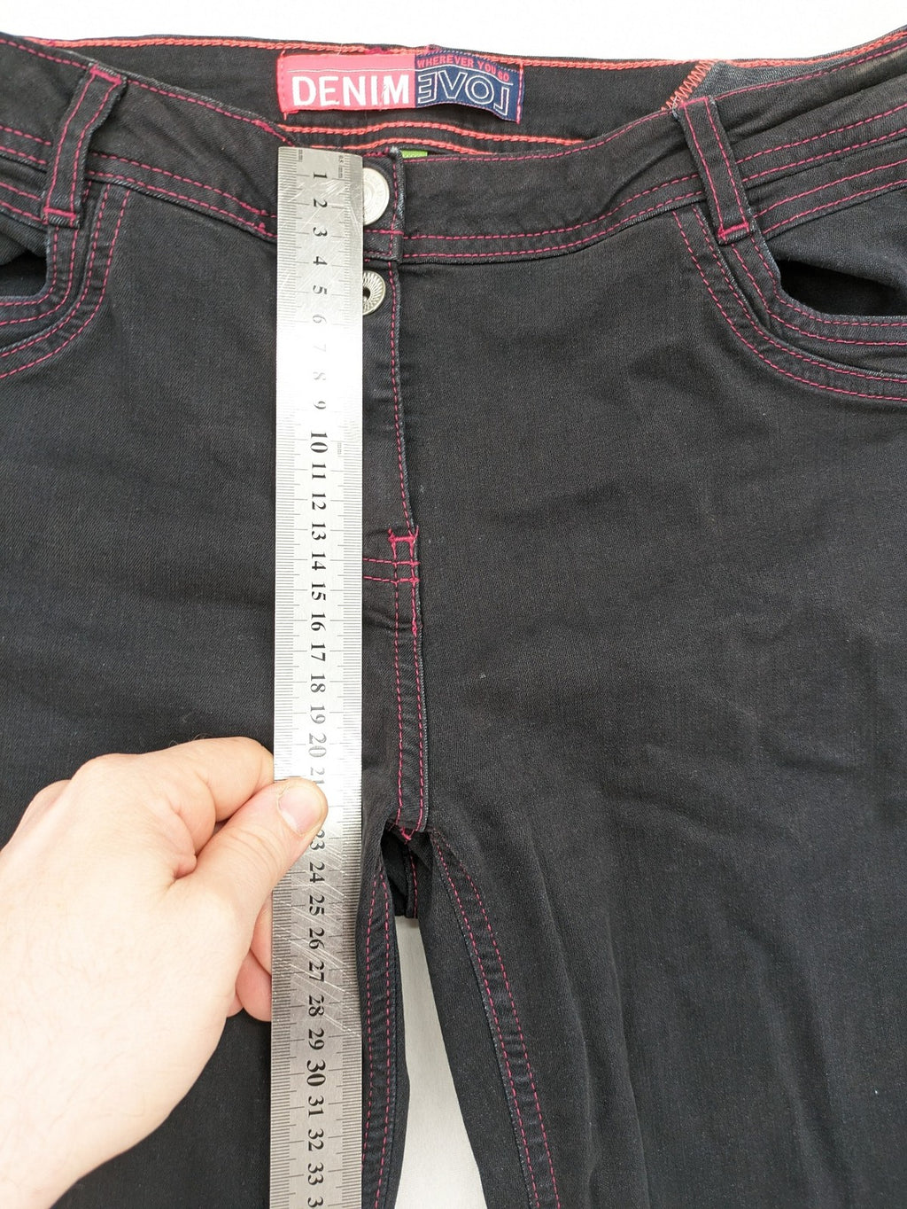 Denim black straight jeans with pink contrast stitching and classic 5-pocket style.