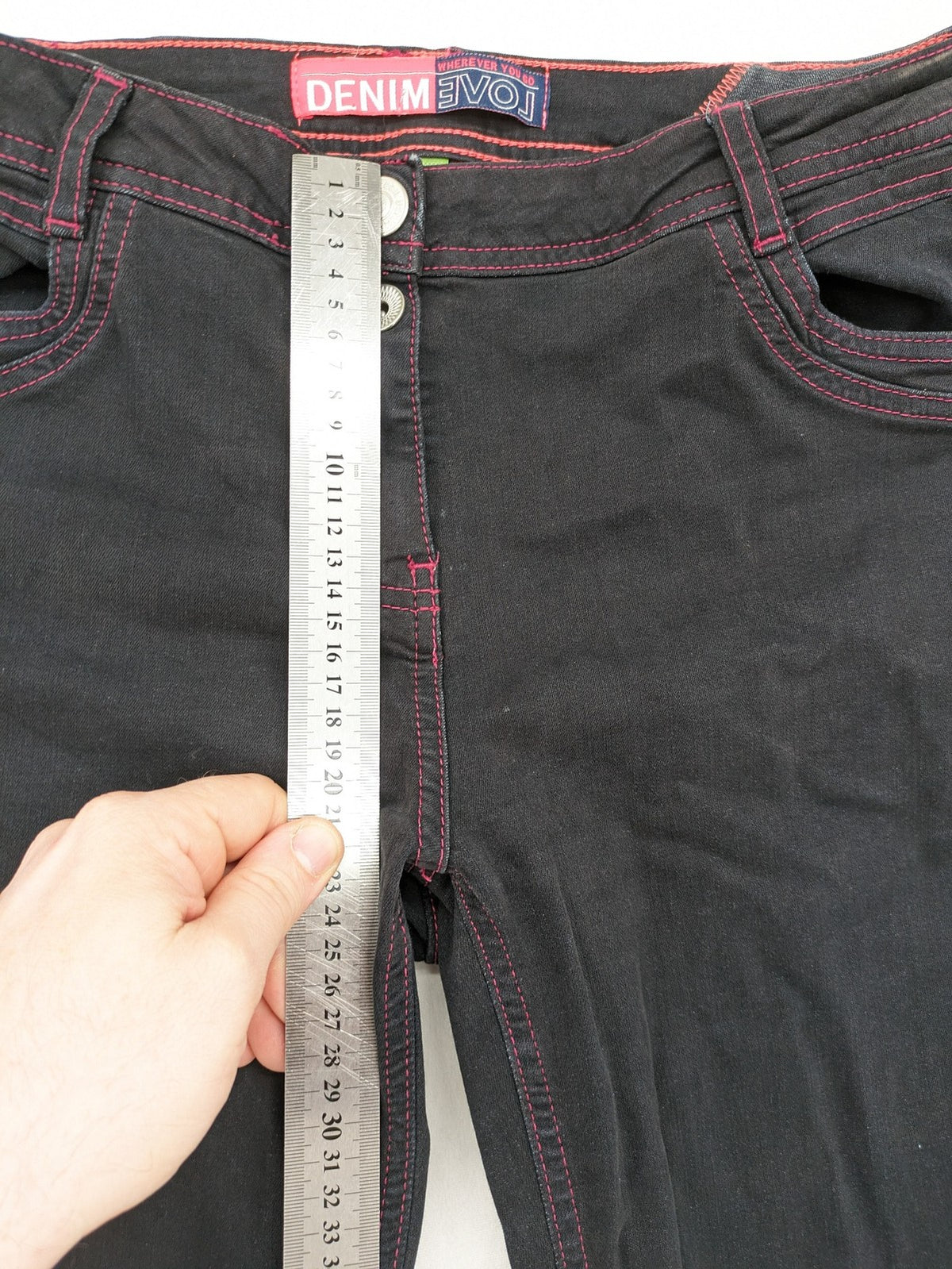 Denim black straight jeans with pink contrast stitching and classic 5-pocket style.