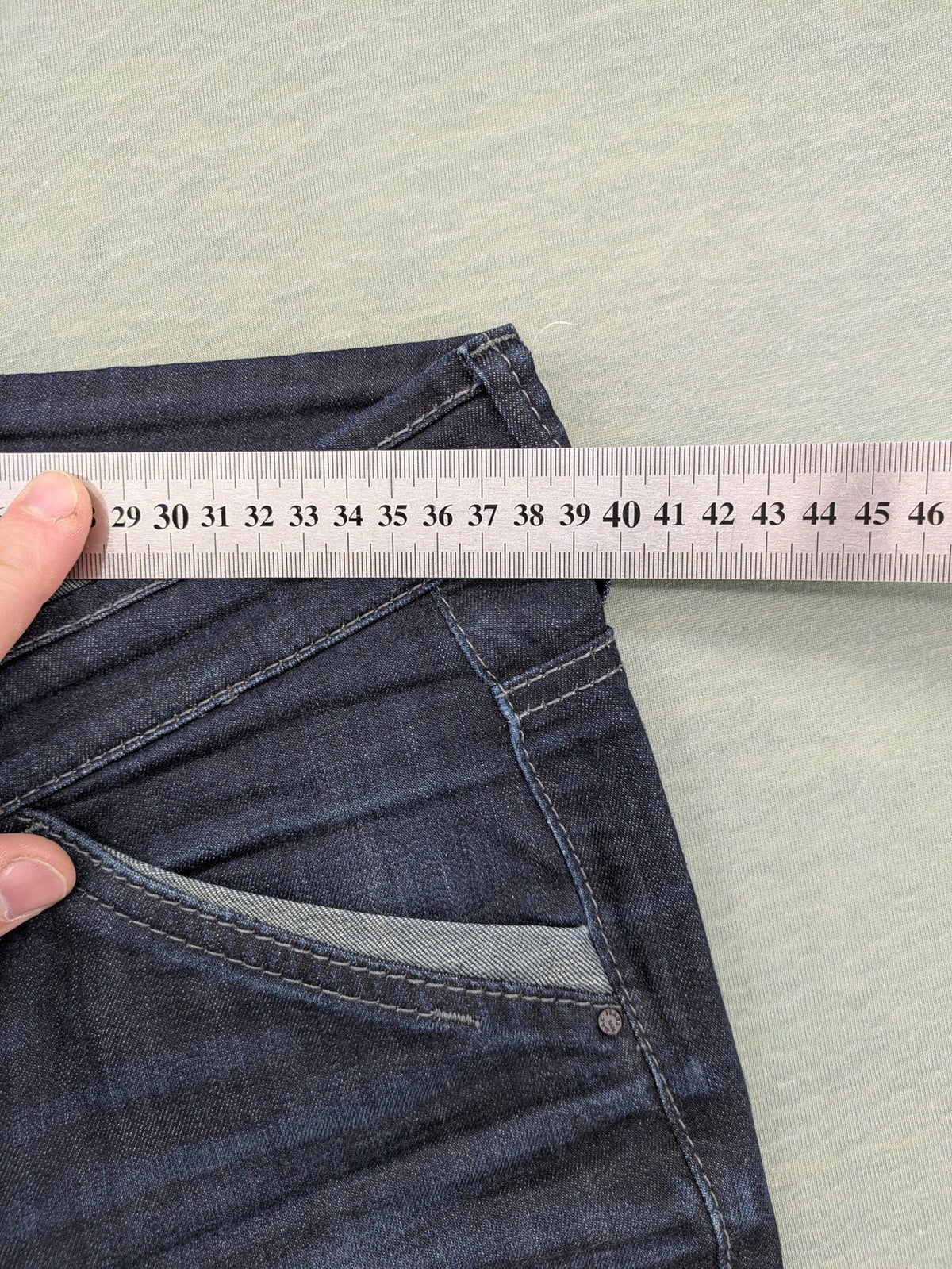 Mac Jeans blue straight jeans dark wash with subtle fading and stretch denim material.