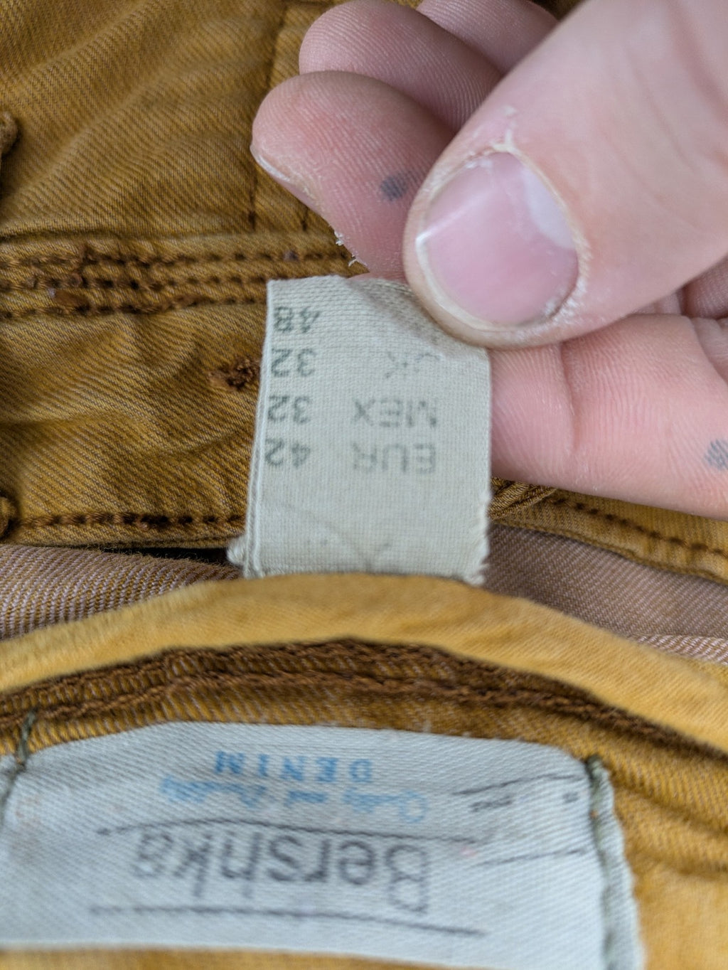 Bershka brown straight jeans slim fit classic 5-pocket design with prominent stitching.