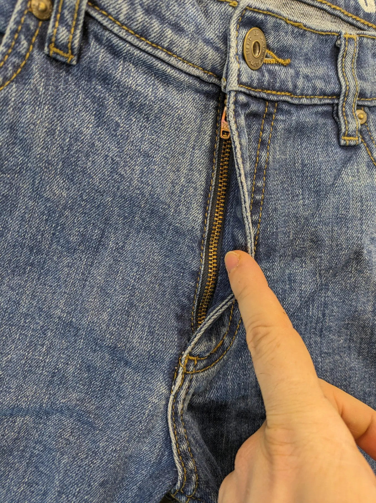 Hero By John Meddox blue straight jeans with five-pocket design and zip fly.