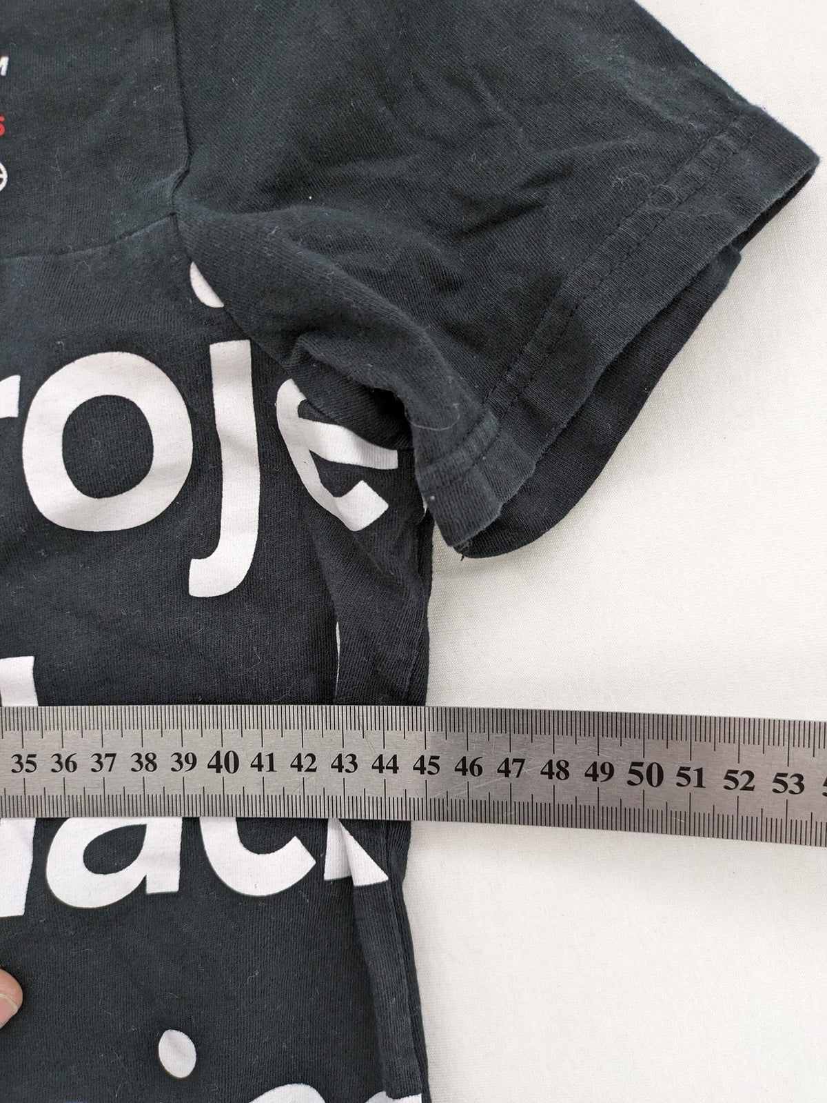Black Squad black t-shirt all-over graphic print with logo patch on sleeve.