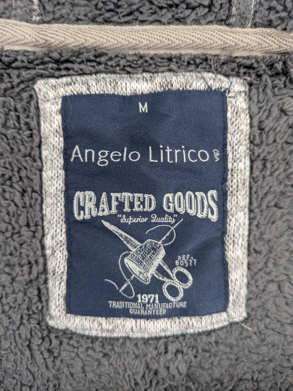 Angelo Litrico grey hoodie with teddy fleece lining, adjustable hood, and retro ski patch.