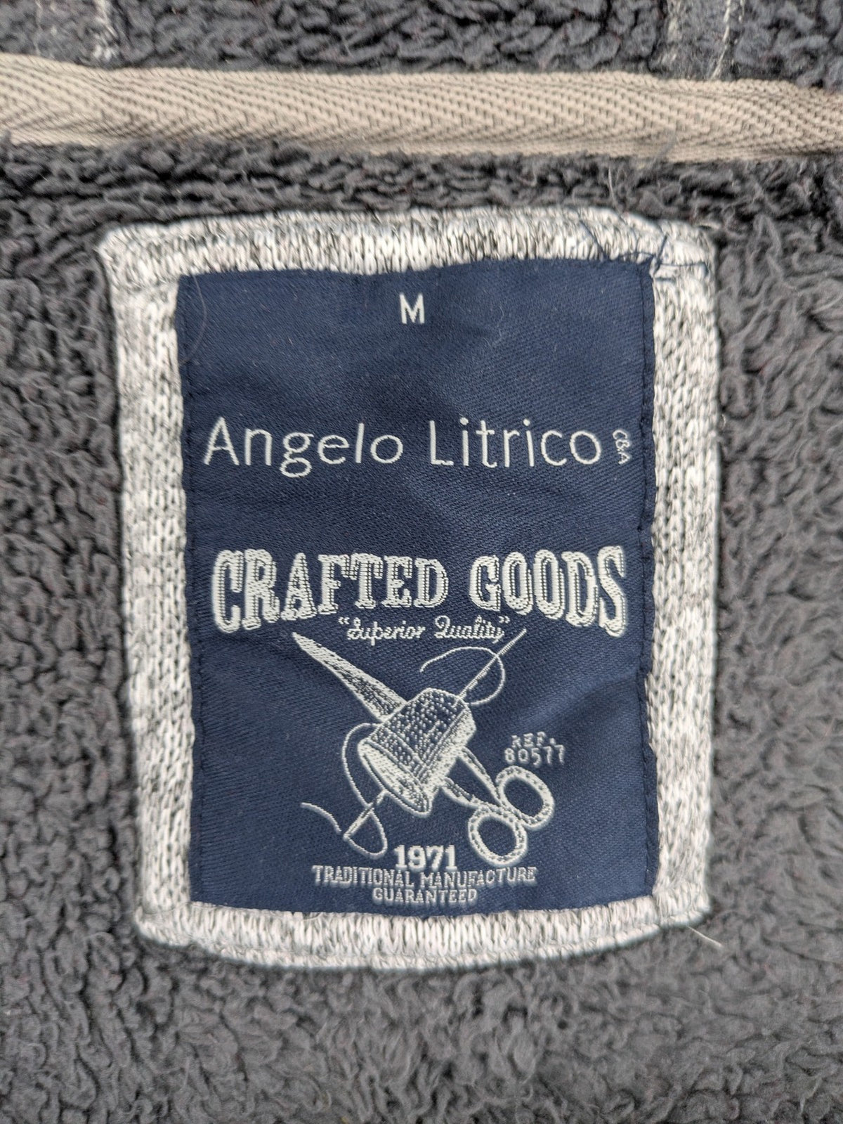 Angelo Litrico grey hoodie with teddy fleece lining, adjustable hood, and retro ski patch.