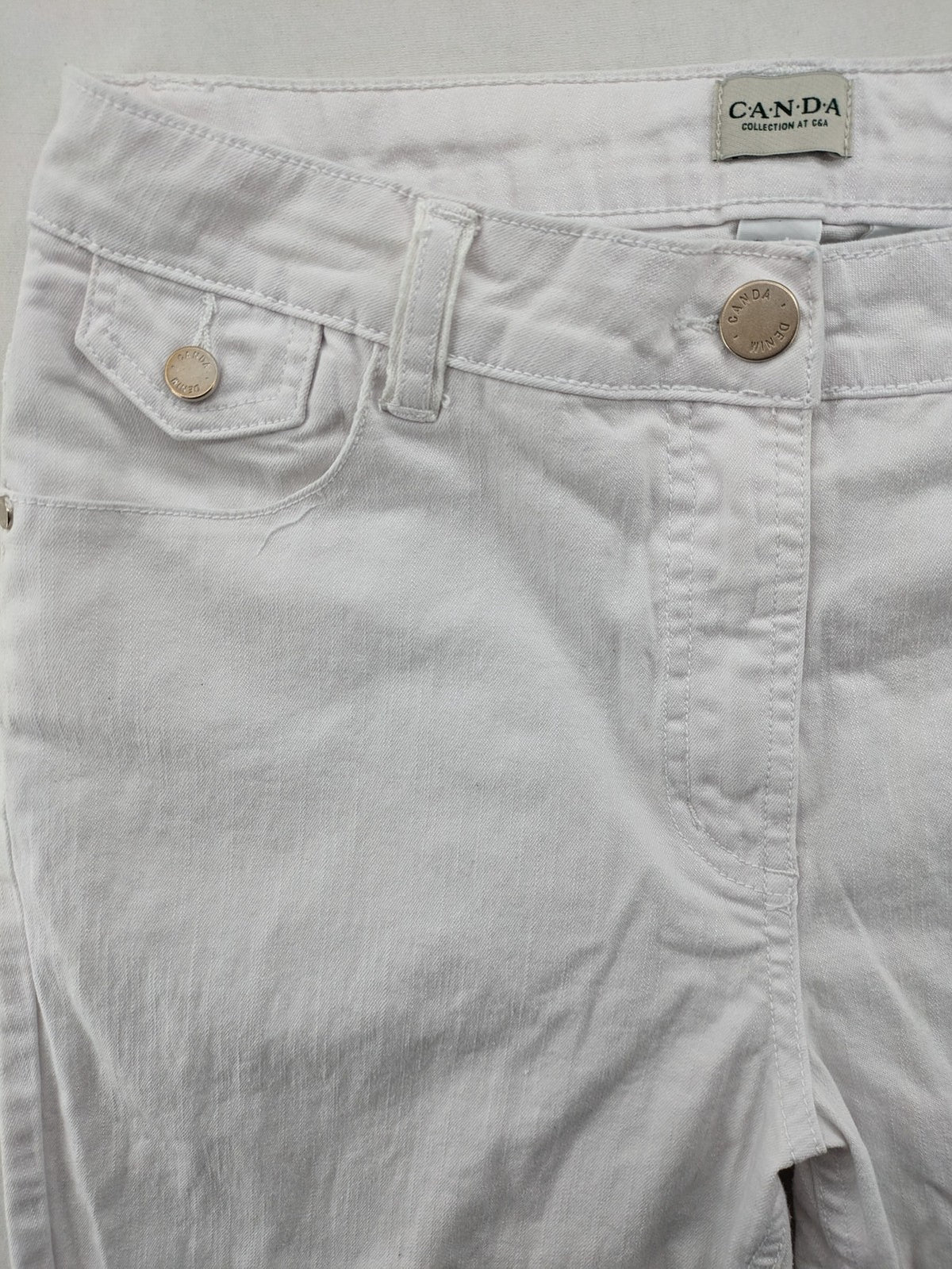 Canda white capri pants cotton-elastane blend with decorative zippers and stylish pockets.