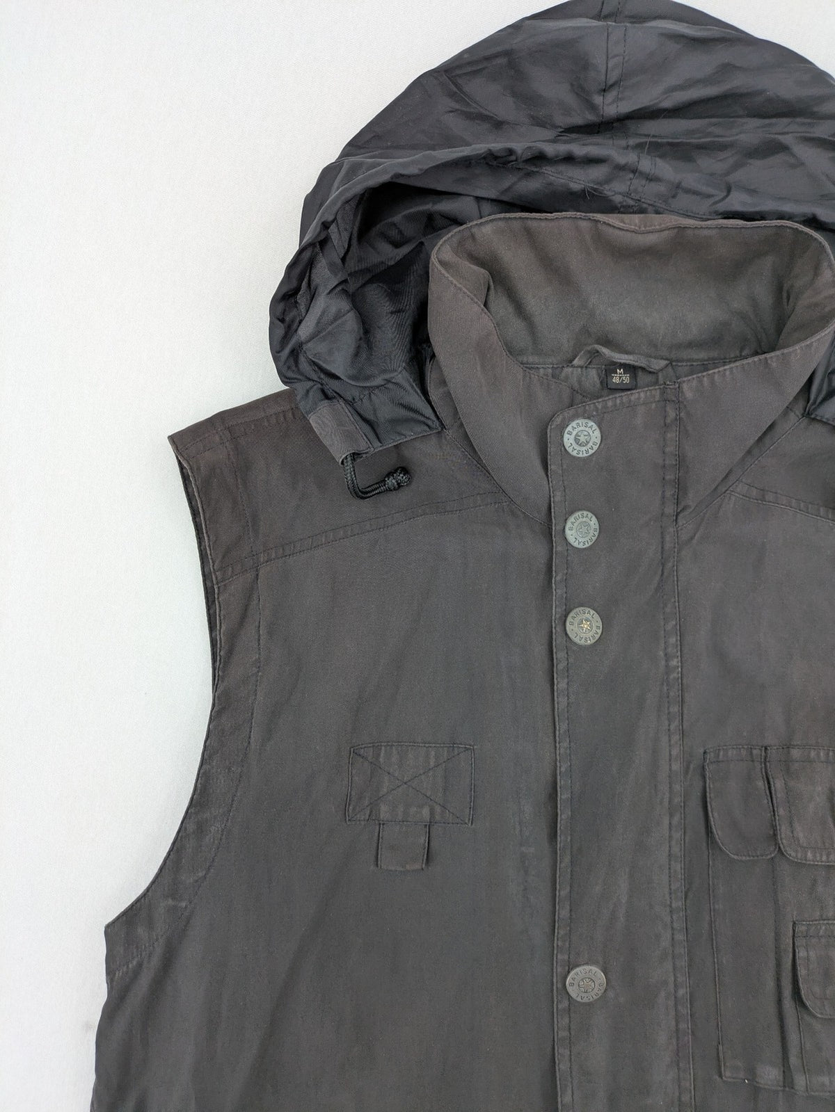 Barisal grey coat with hood, cargo pockets, and checkered lining detail.