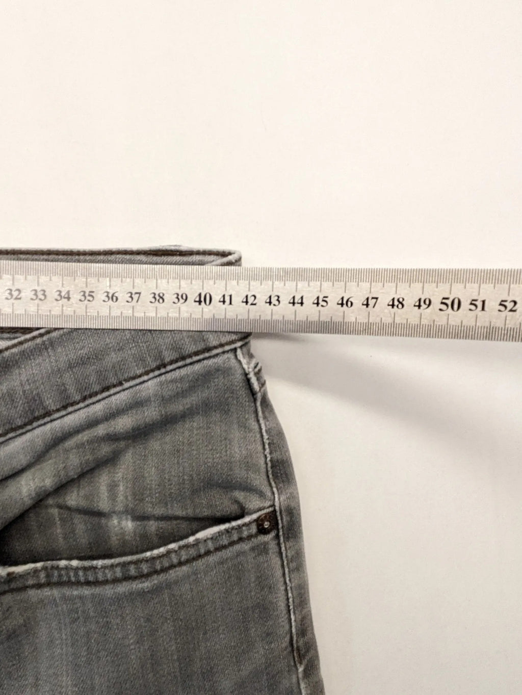 BRAX grey straight jeans with classic 5-pocket style and washed denim finish.