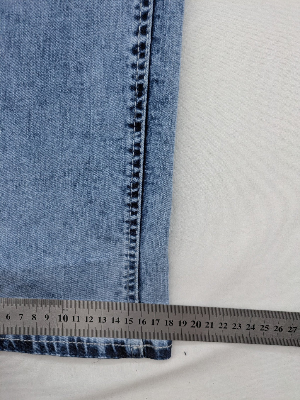 Multiblu blue straight jeans slim fit with decorative front zippers and light wash.