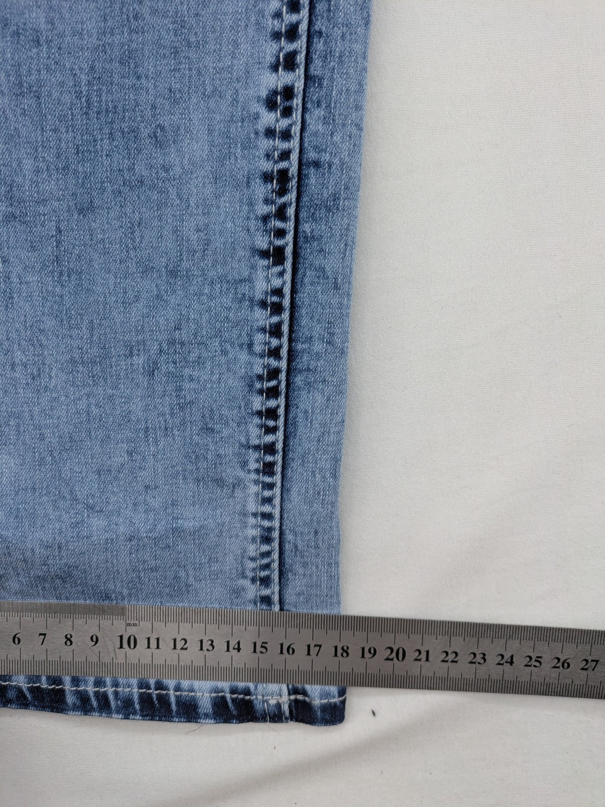 Multiblu blue straight jeans slim fit with decorative front zippers and light wash.