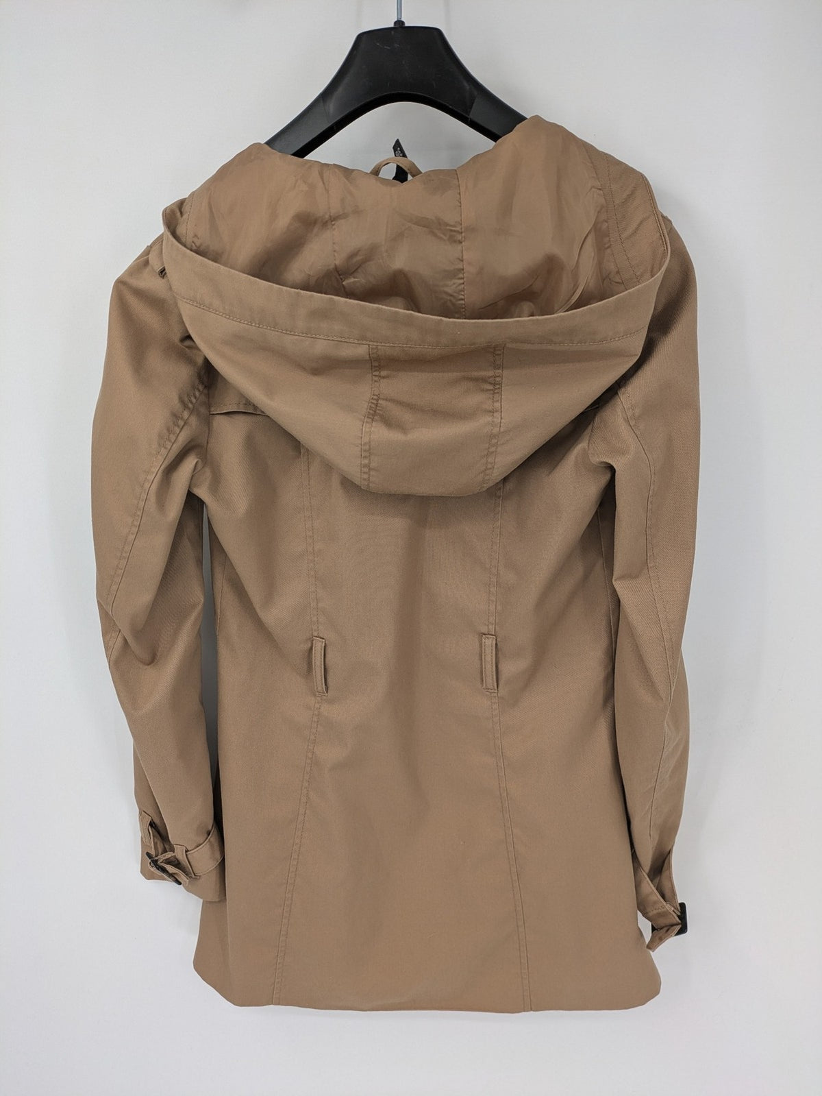 H&M Divided beige trench coat with button closure, hood, and polka dot lining.