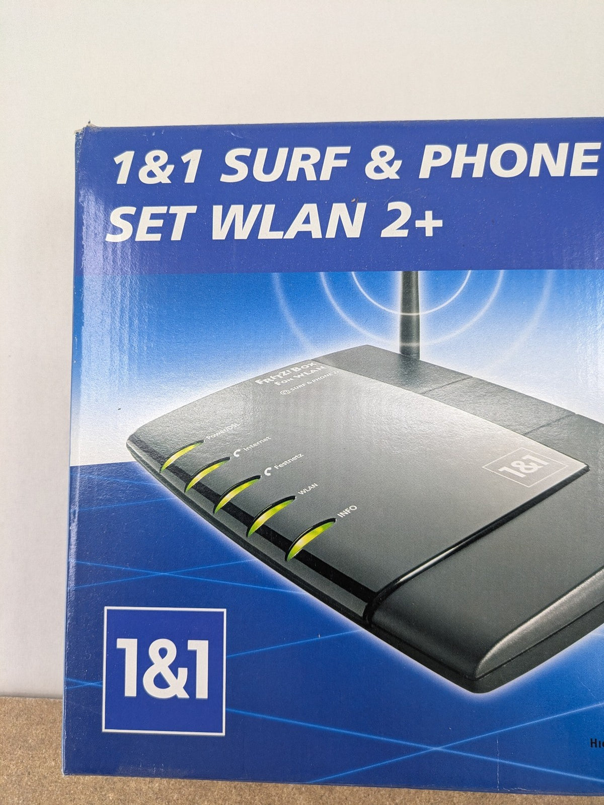 AVM VoIP gateway router blue with integrated DSL modem and phone system features.