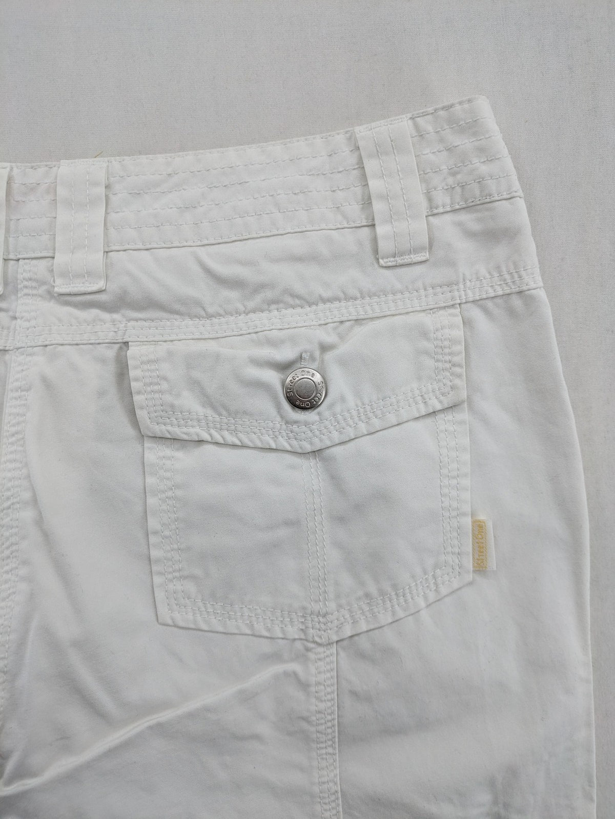 Street One white cargo pants with side pockets and wide leg design.