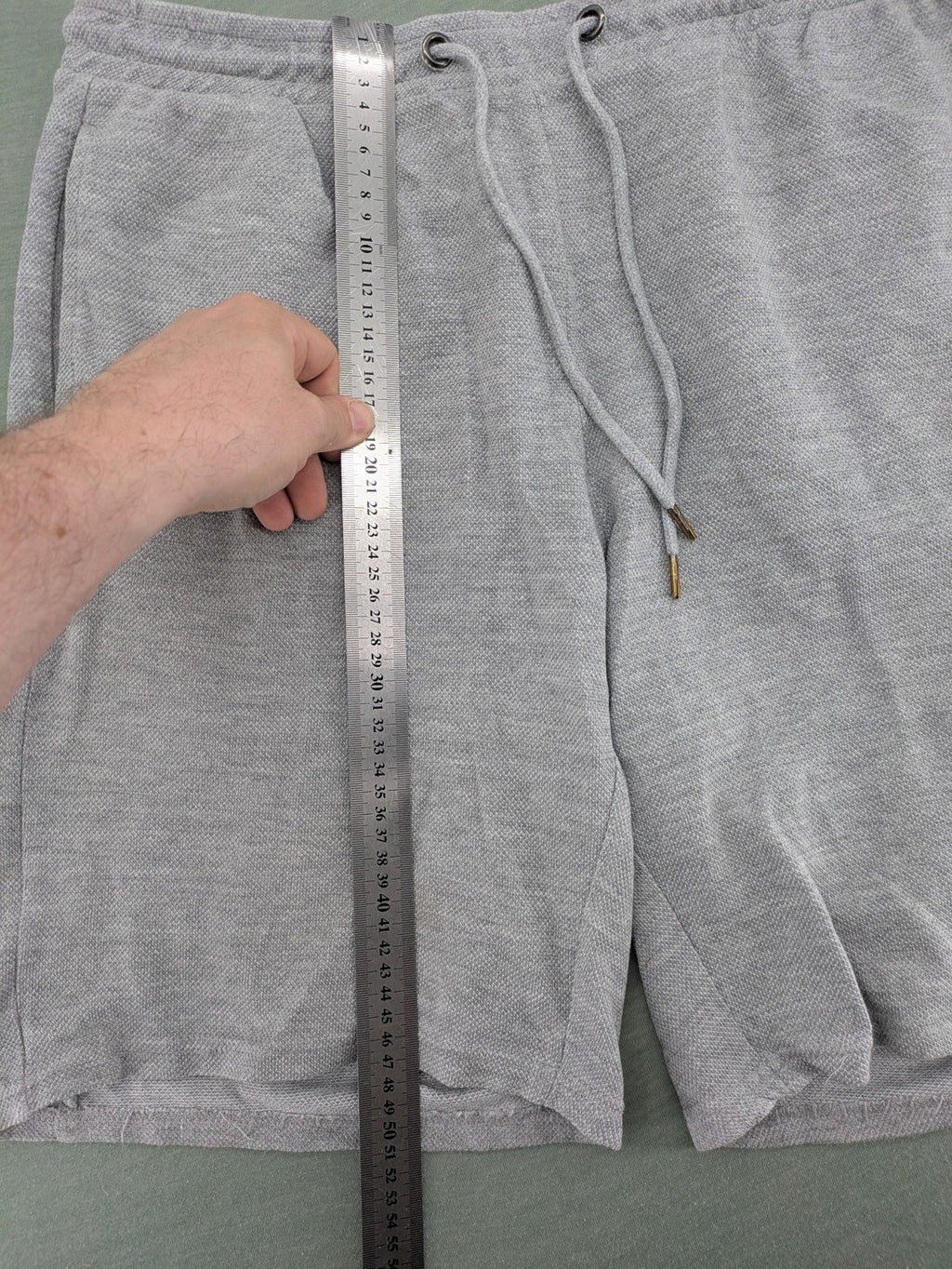 Livergy grey sweat shorts with elastic waistband, drawstring, and side pockets.