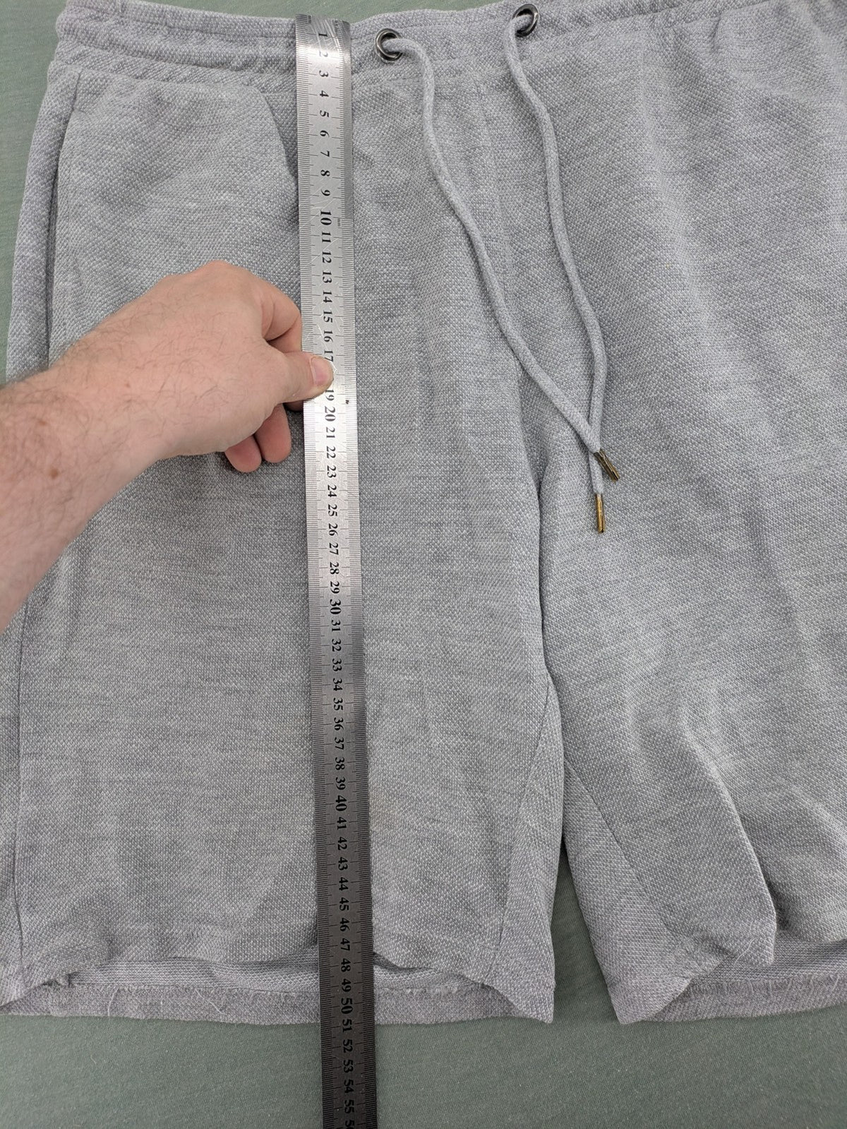 Livergy grey sweat shorts with elastic waistband, drawstring, and side pockets.