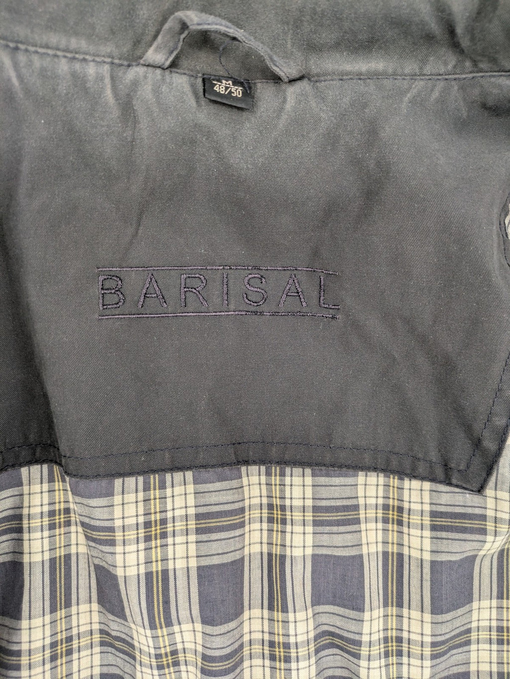 Barisal grey coat with hood, cargo pockets, and checkered lining detail.