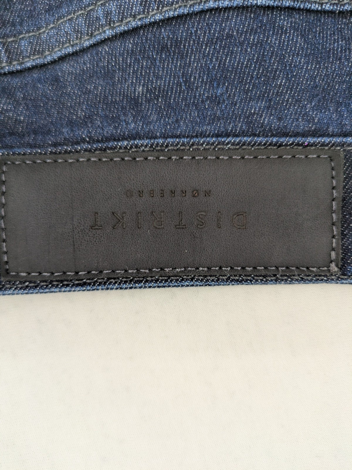 DISTRIKT NØRREBRO blue slim fit jeans with classic rinse wash and stretch denim material.
